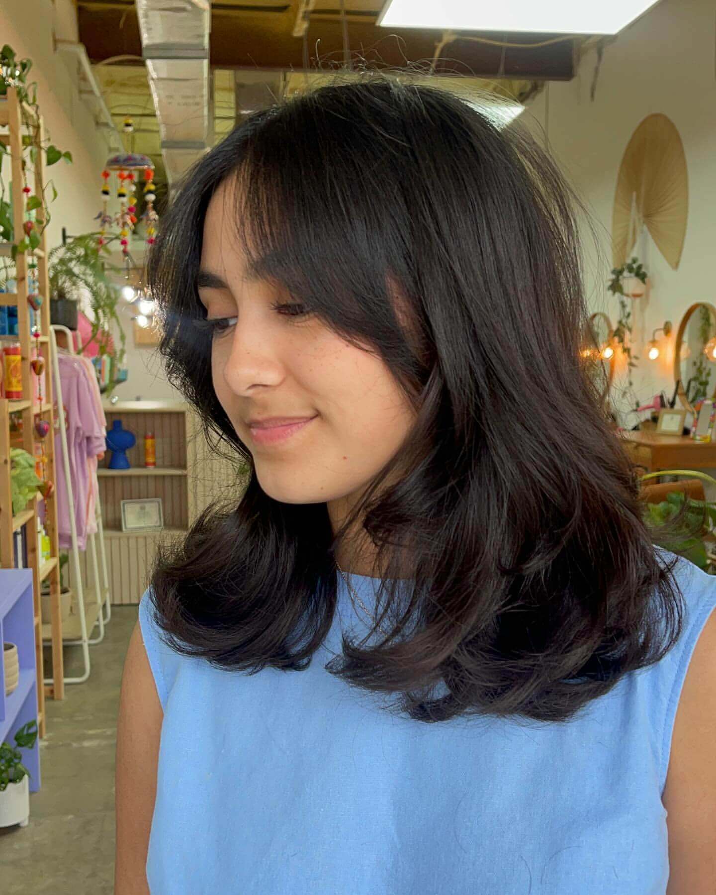 Fresh medium-length waves with curtain bangs