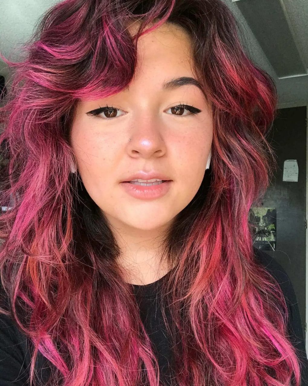 Bright fuchsia waves with long, side-swept bangs