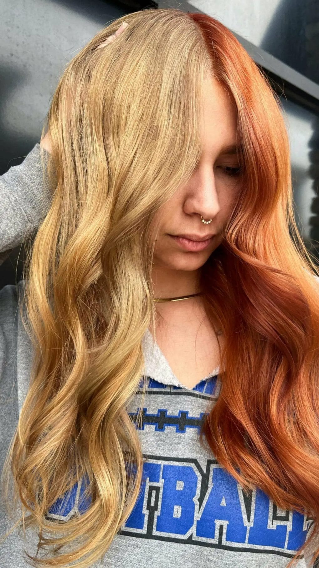Ginger and blonde waves blend in a striking half and half effect