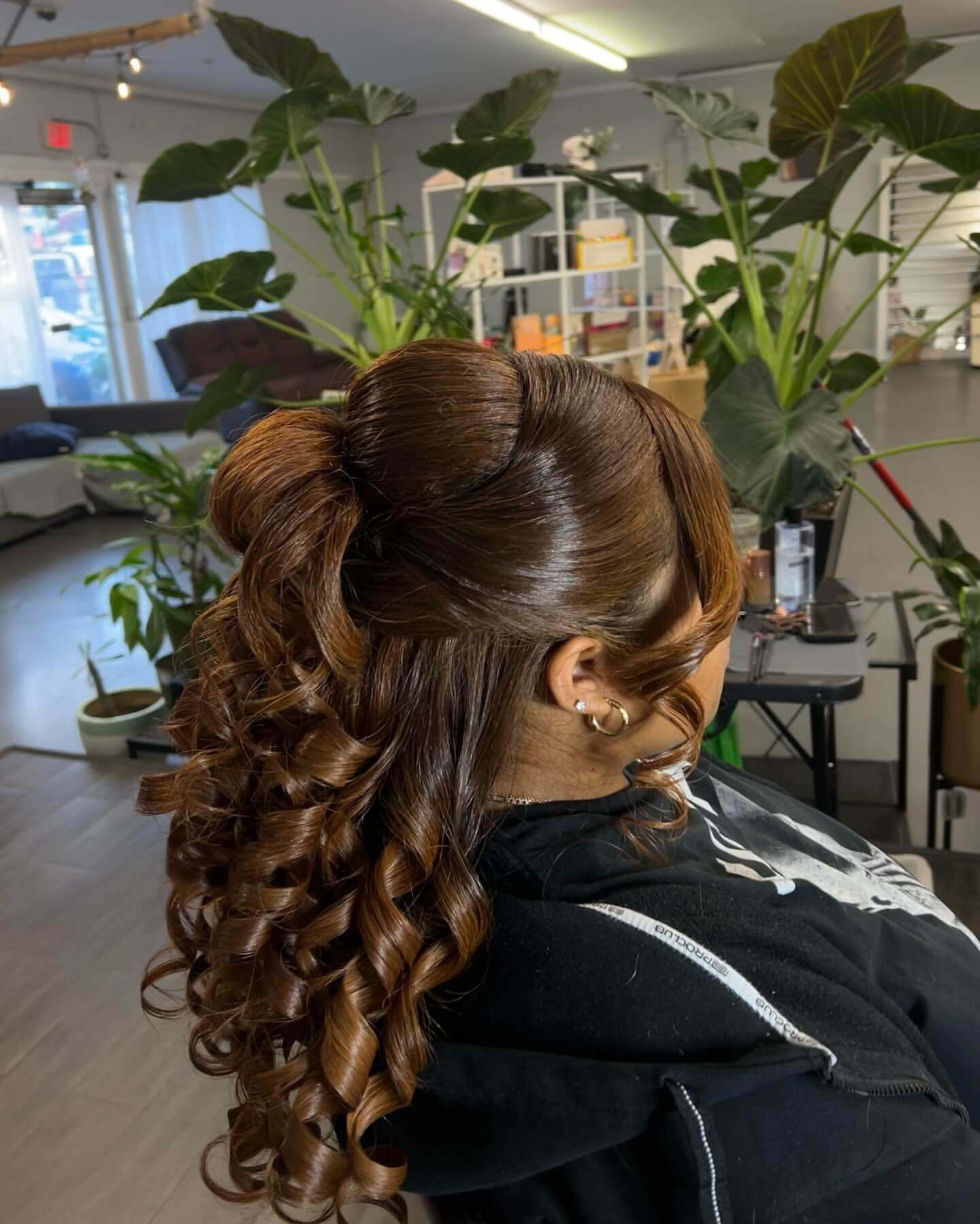 Glamorous chocolate brown curls with sleek top