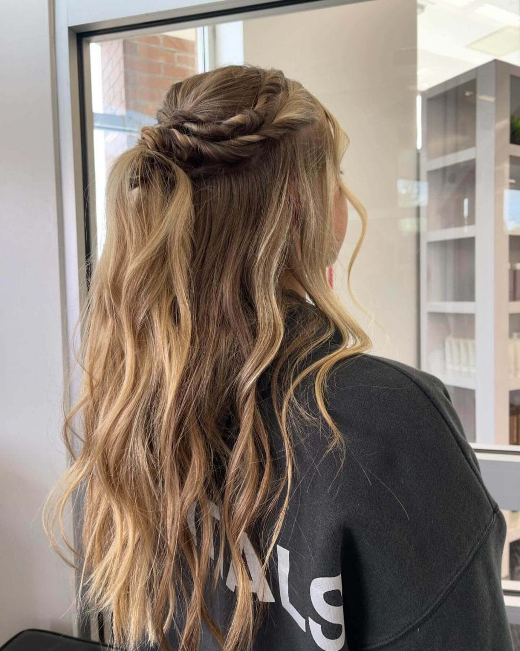 Half-up blonde hair with elegant braids and loose waves