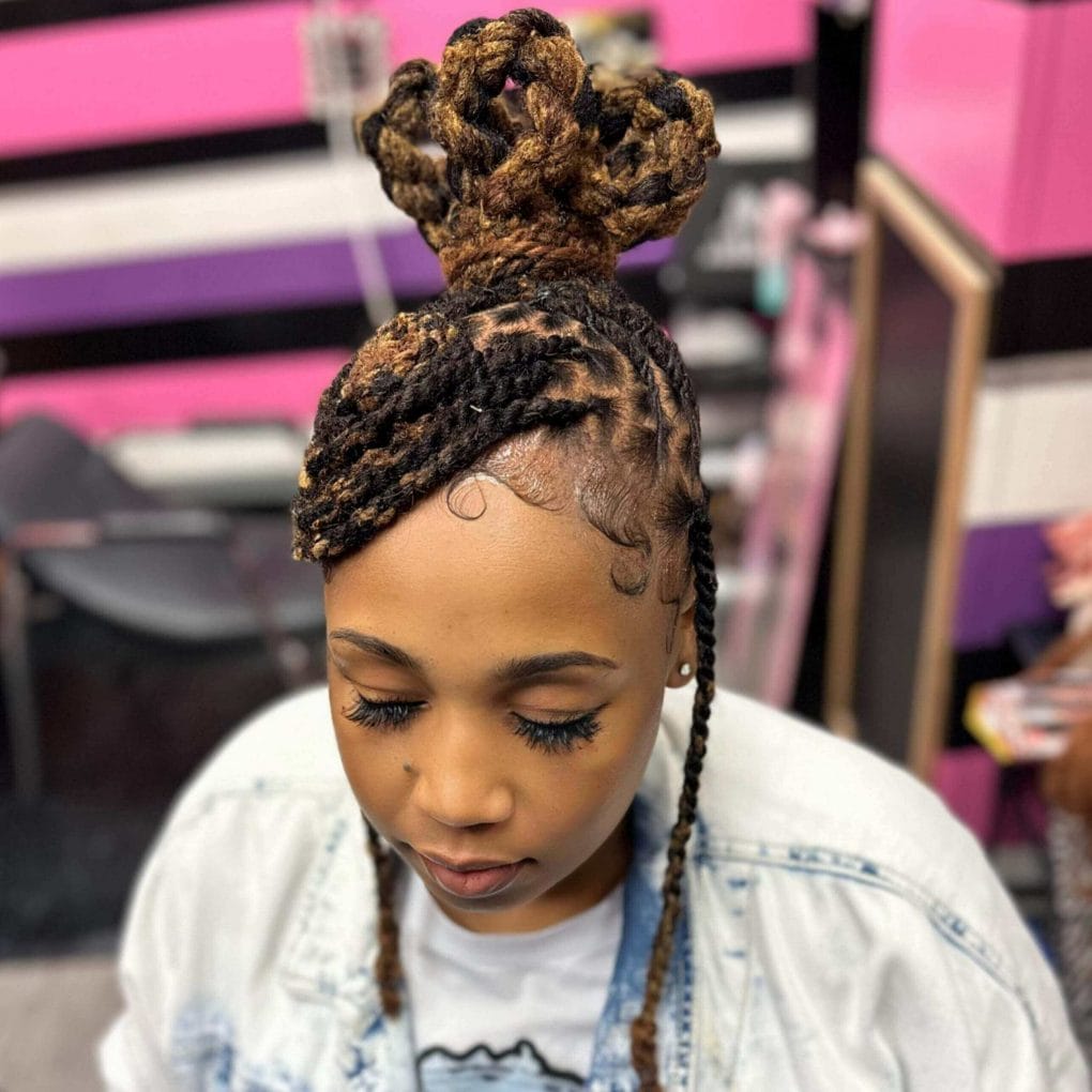 High bun with intricate braids and golden-brown contrast