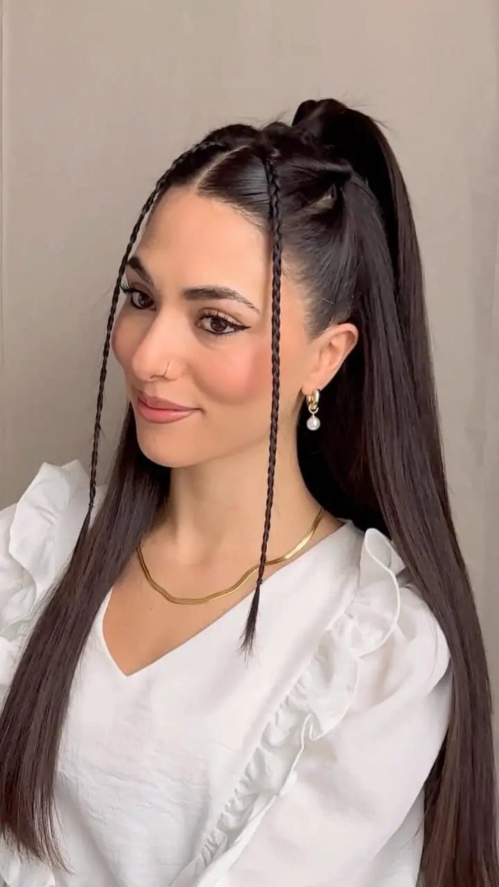 Sleek and edgy high ponytail with face-framing braids