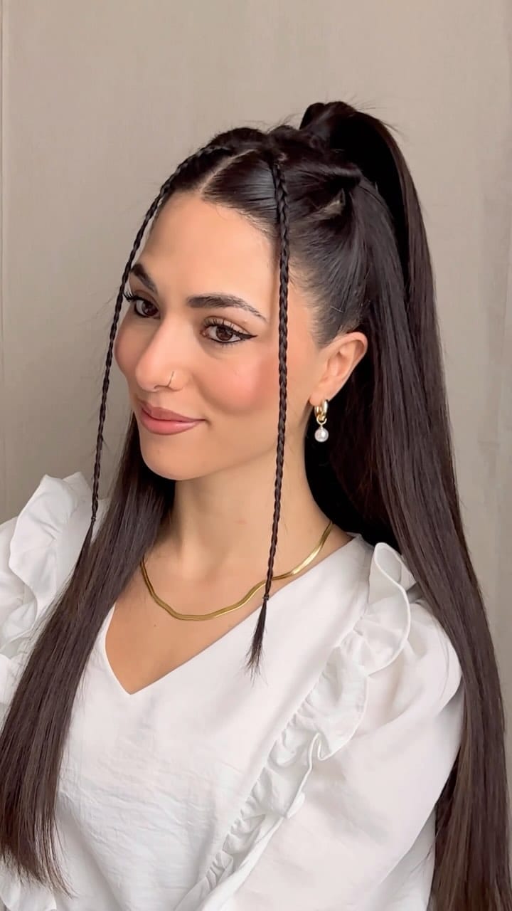 Sleek and edgy high ponytail with face-framing braids