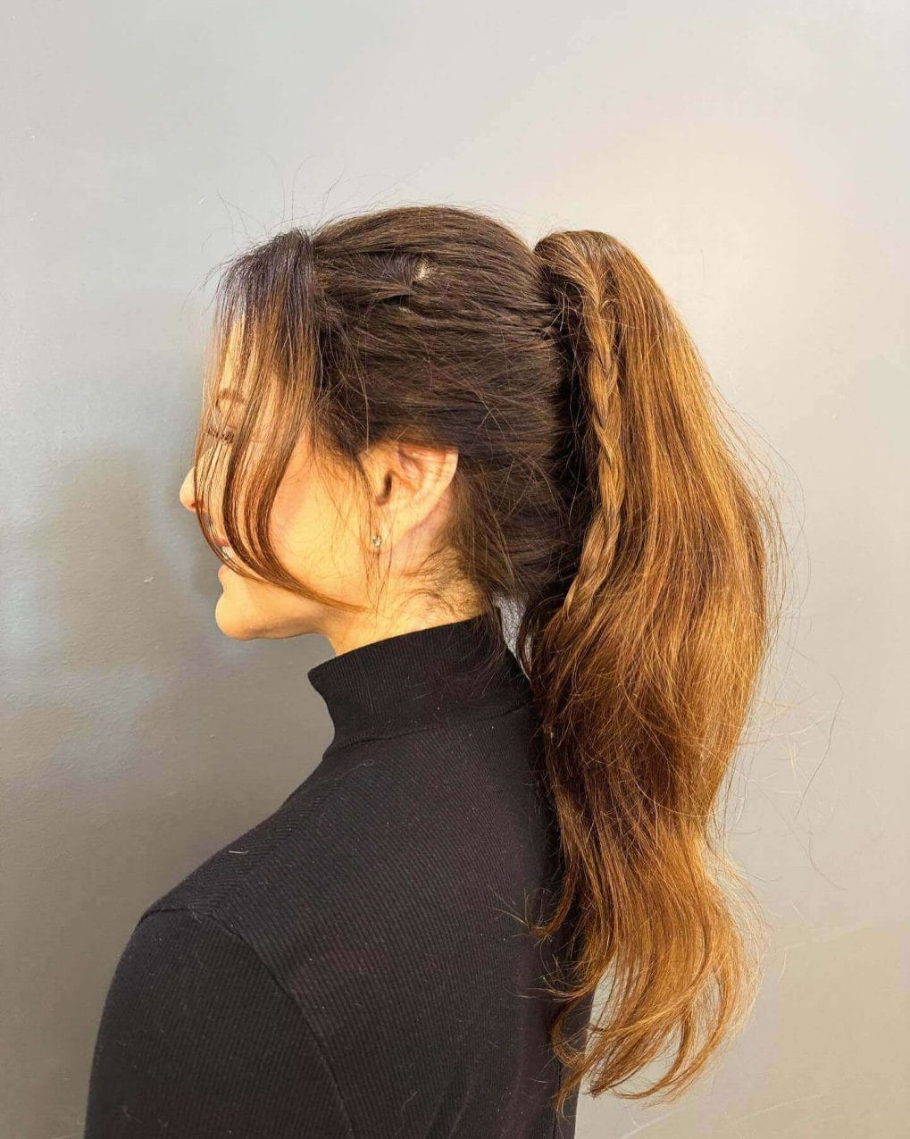 Simple high ponytail with a braid in light and dark brown tones for softball