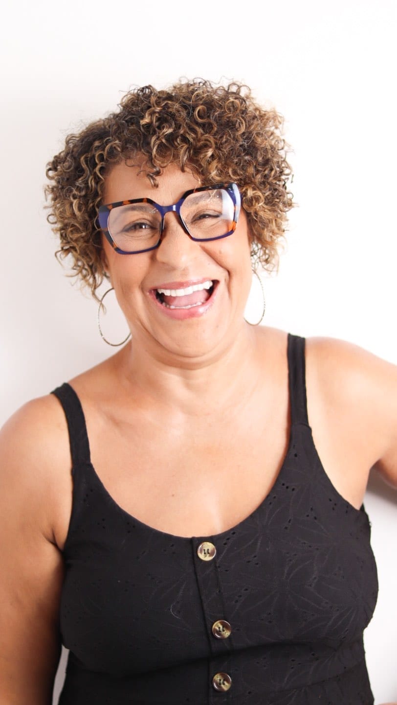 Joyful curly pixie with honey highlights and bouncy curls