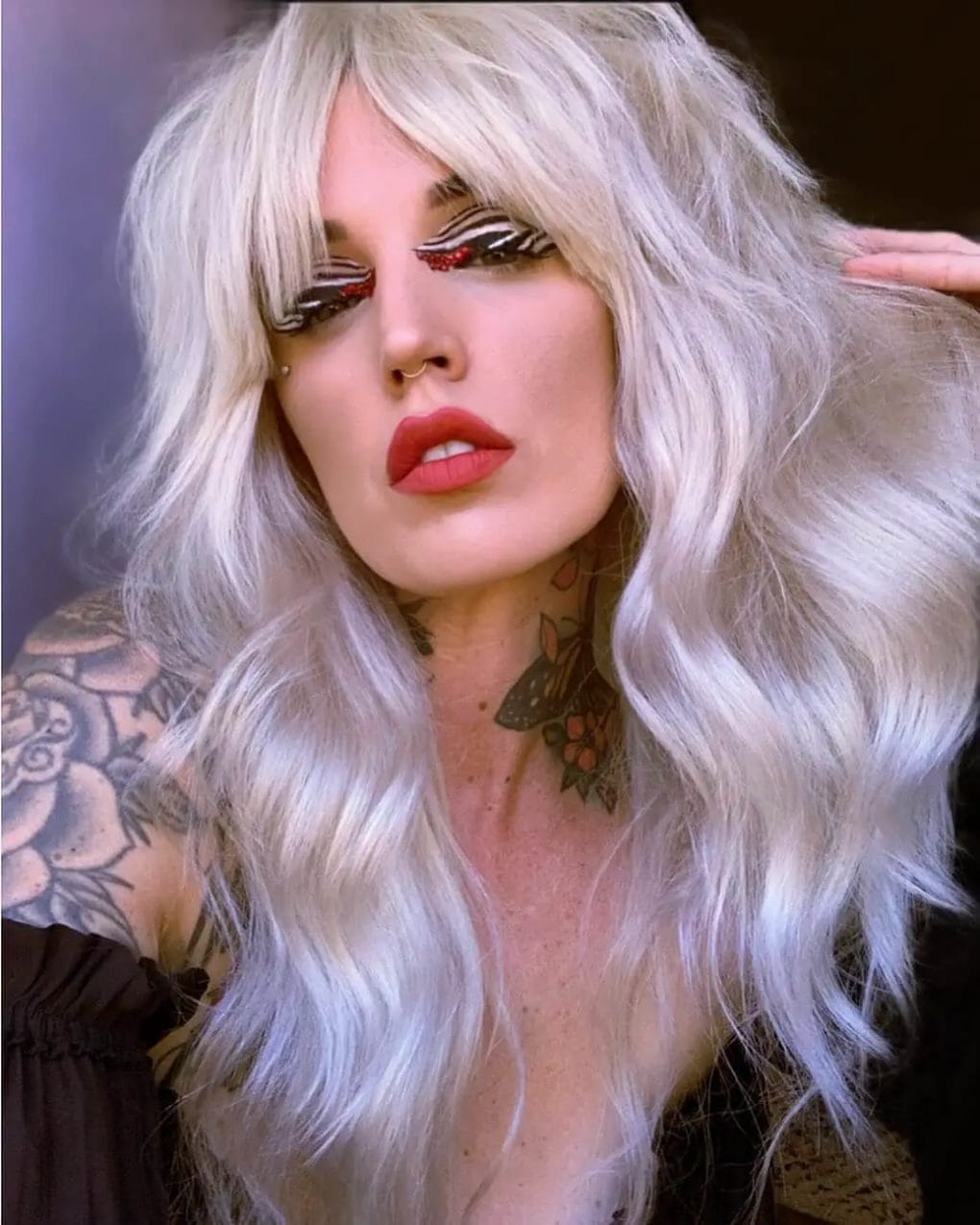 Full-bodied icy platinum waves with feathered bangs