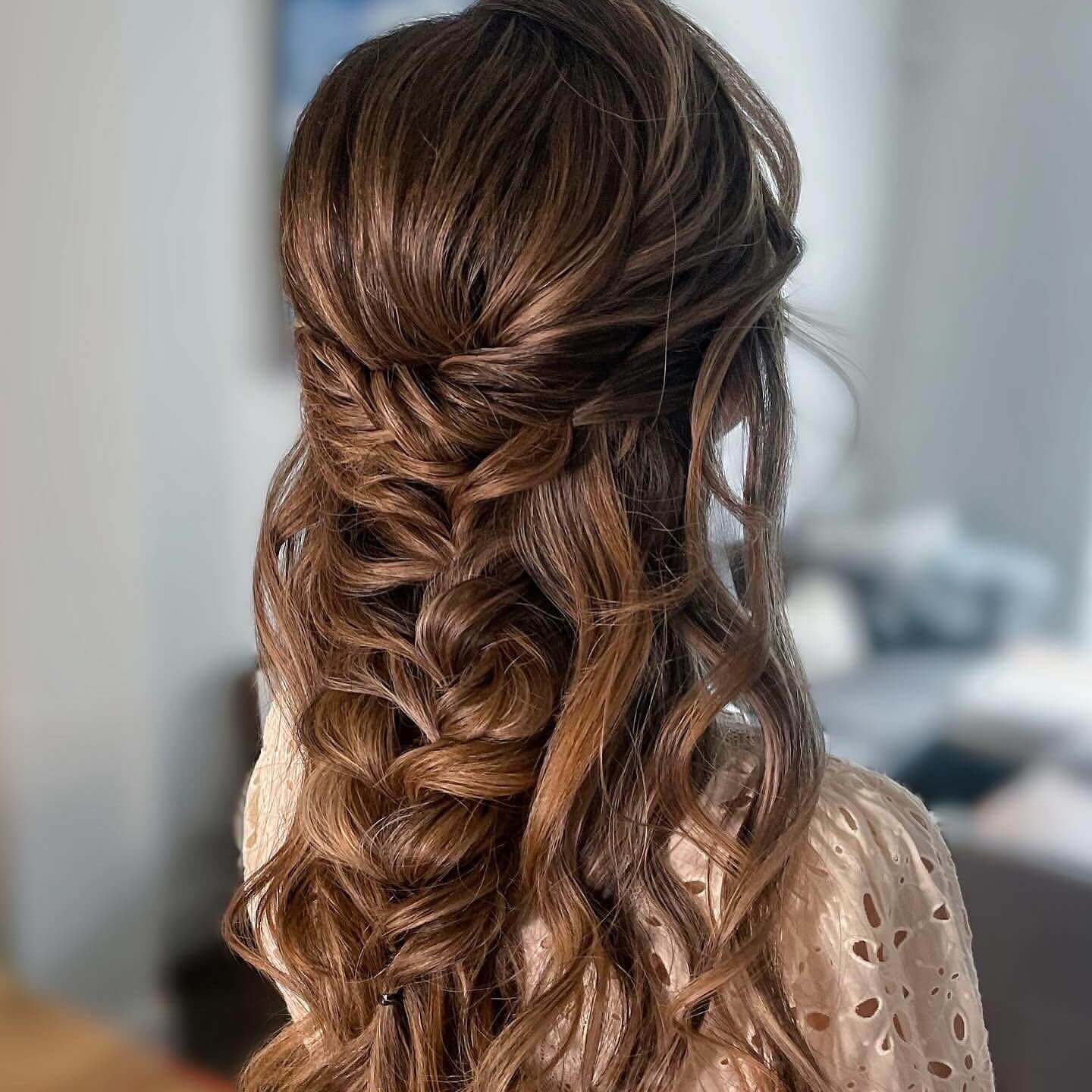 Intricate chestnut braid with loose curls