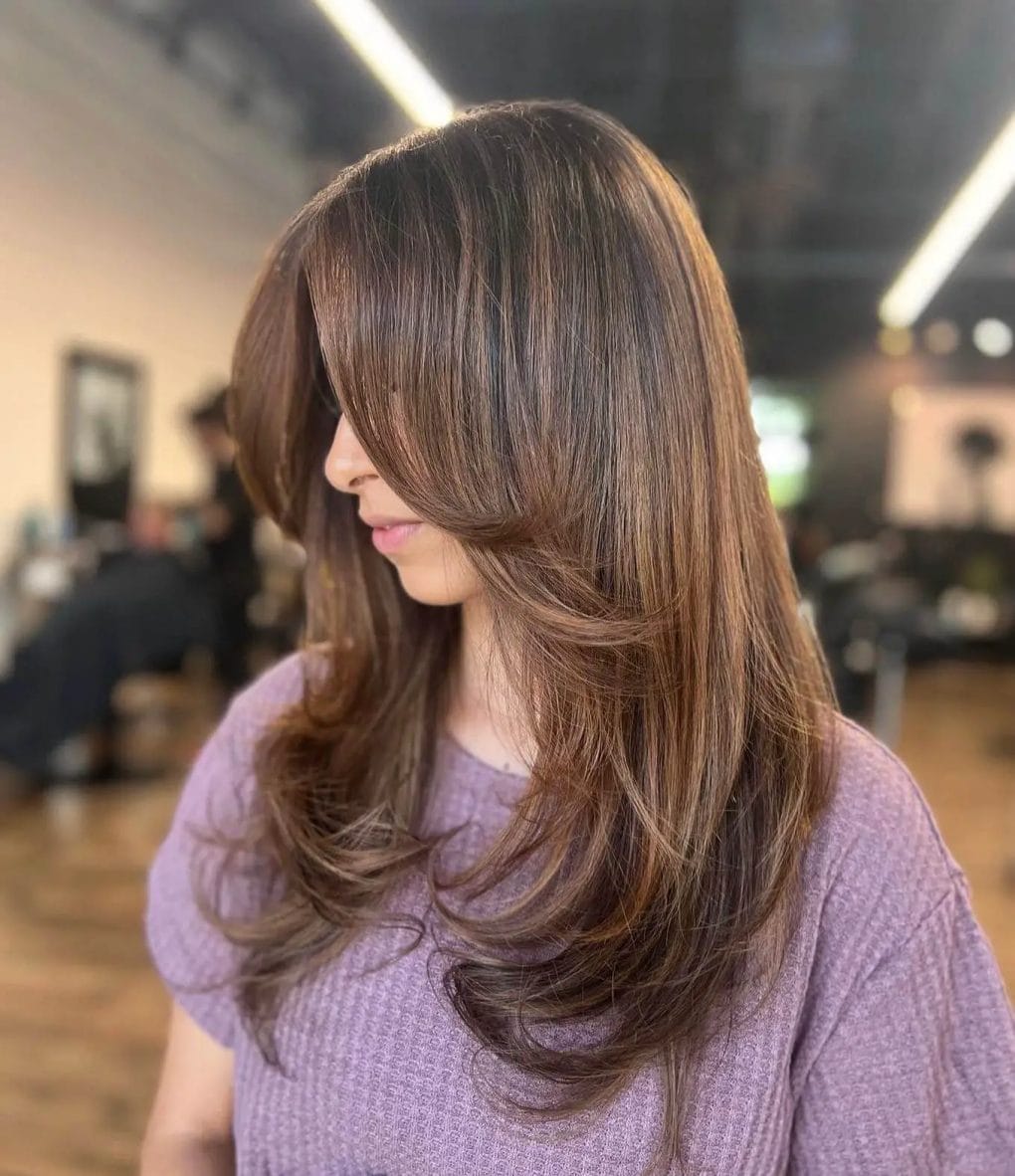 Brunette balayage with strategic layers showcasing depth and brilliance.