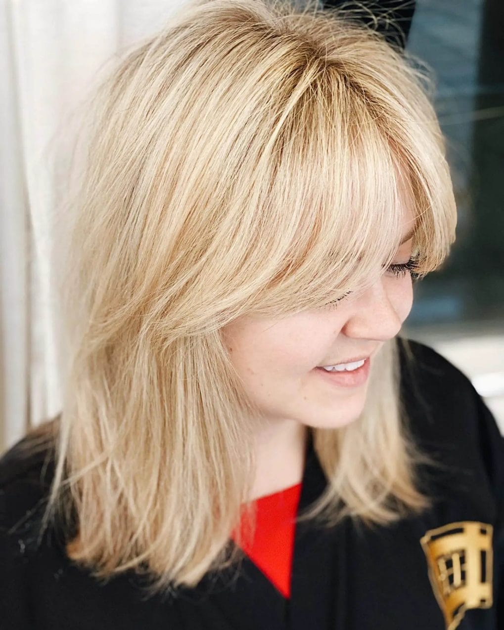 Light blonde with effortless texture and subtle feathered bangs, emphasizing a fresh and youthful vibe.
