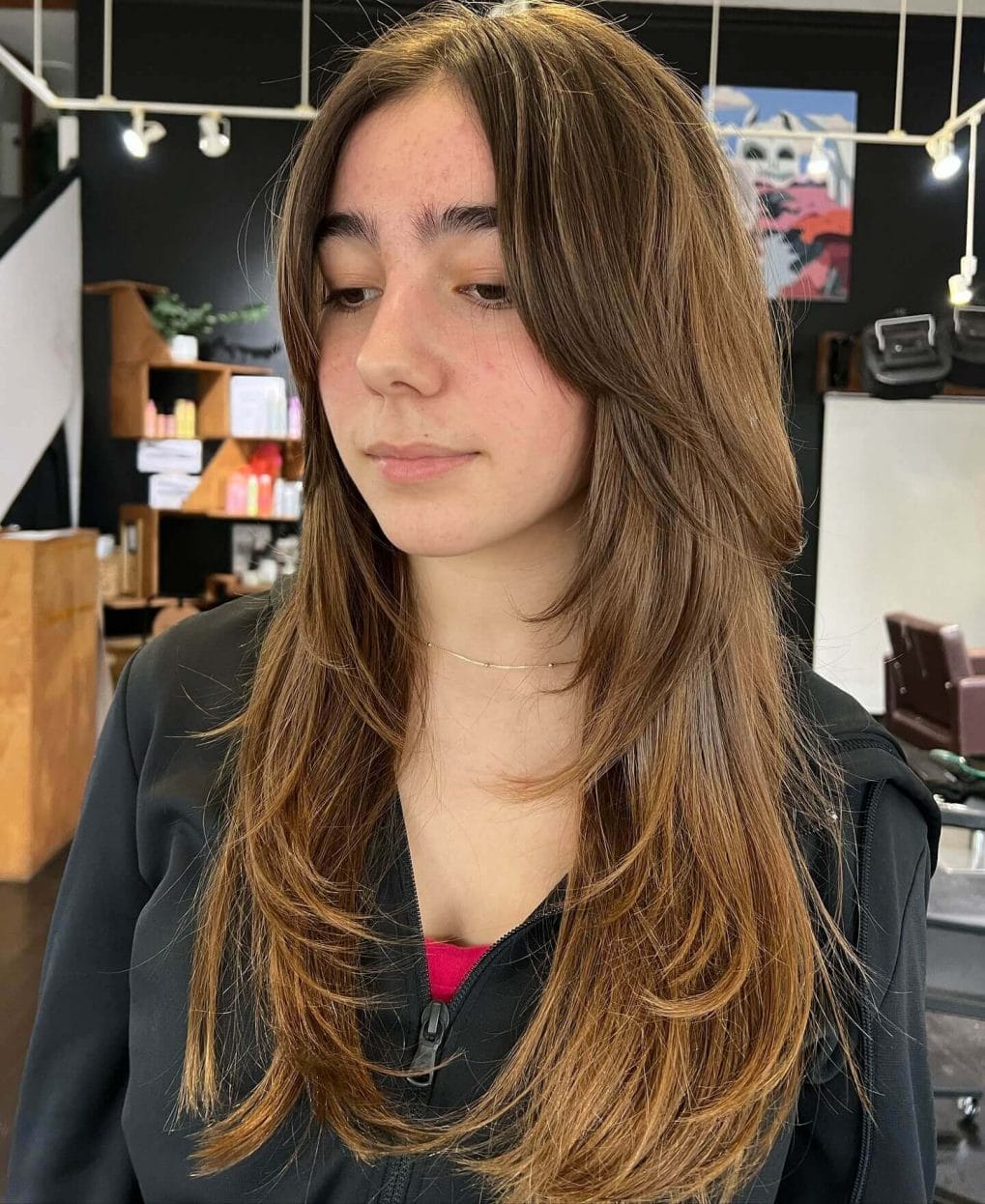 Light brown layers with 90s curtain bangs effortless