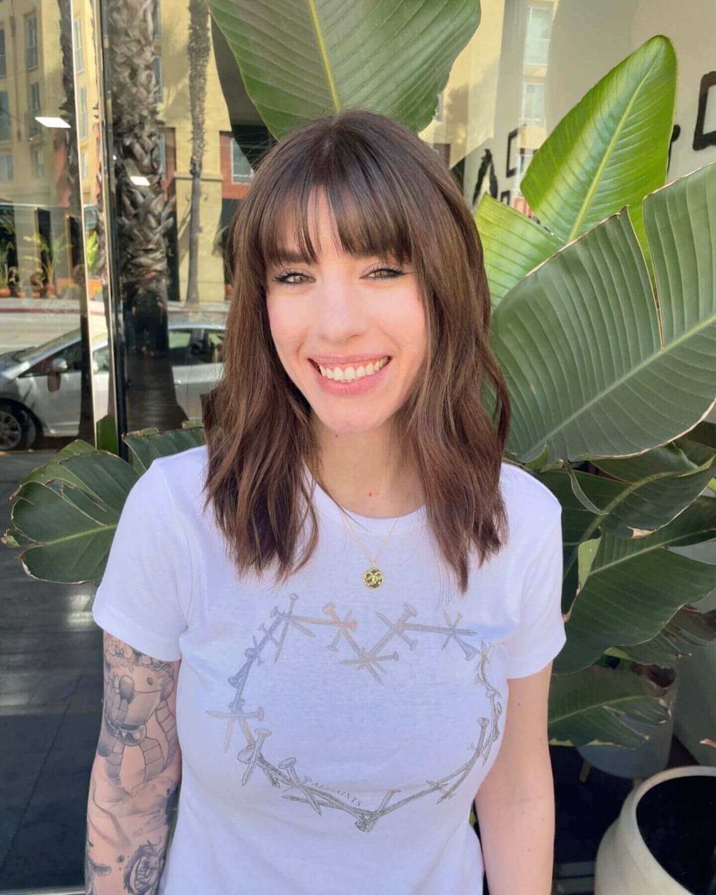 Medium-length light brown waves with see-through bangs