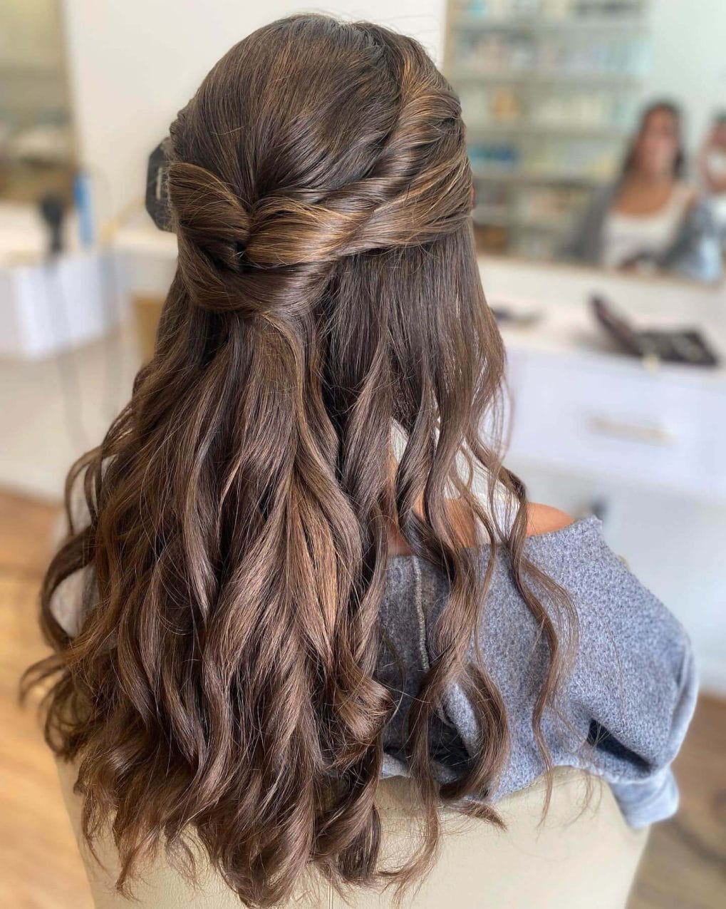 Long brunette hair with romantic curls and pinned-back top
