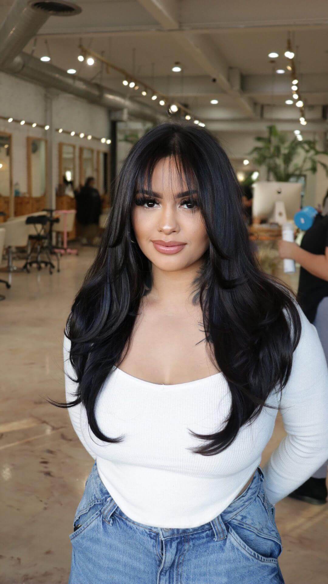 Long voluminous layers with see-through bangs