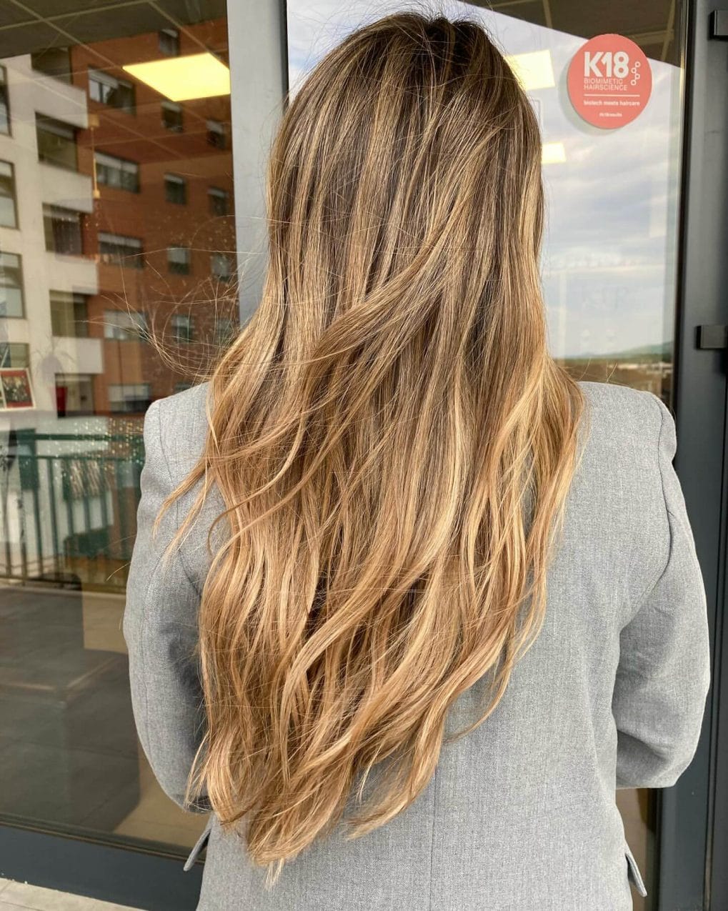 Long flowing layers with warm blonde and brown balayage