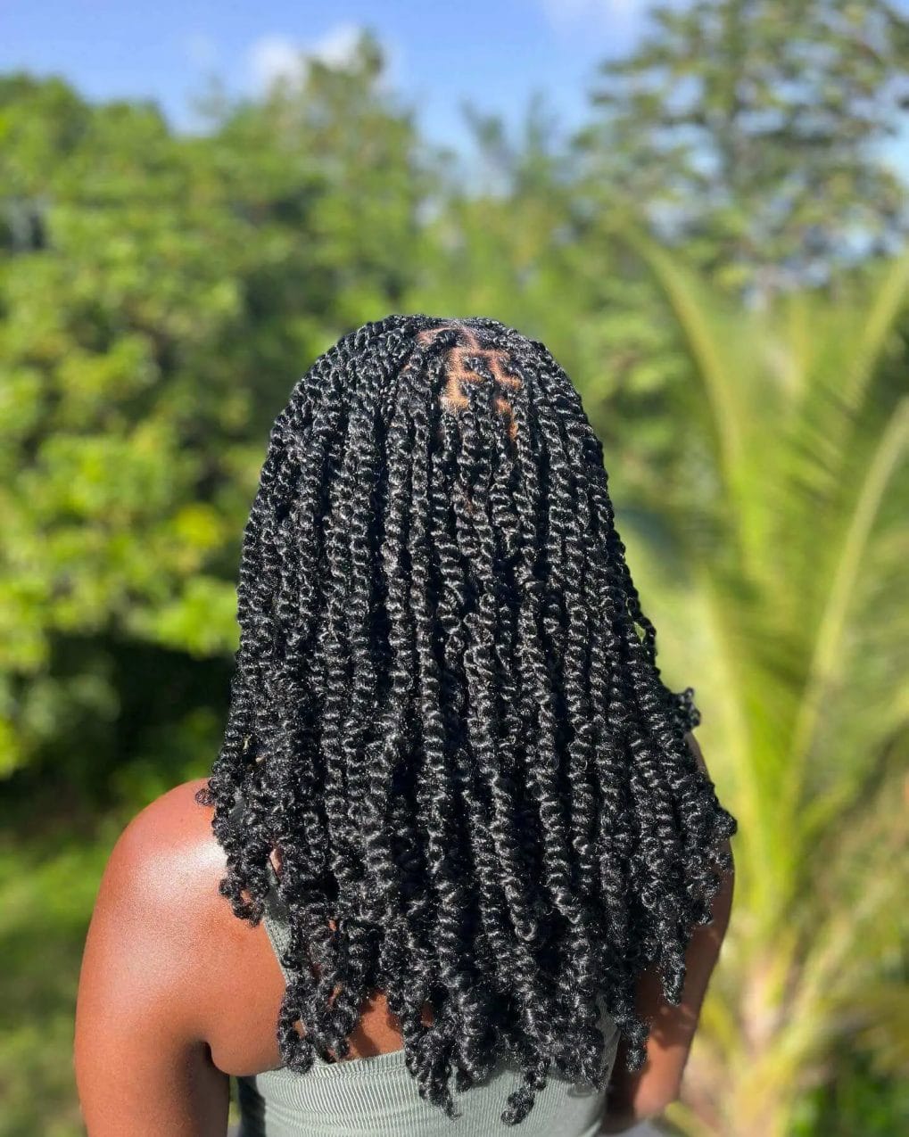 Long, natural black spring twists flowing down the back