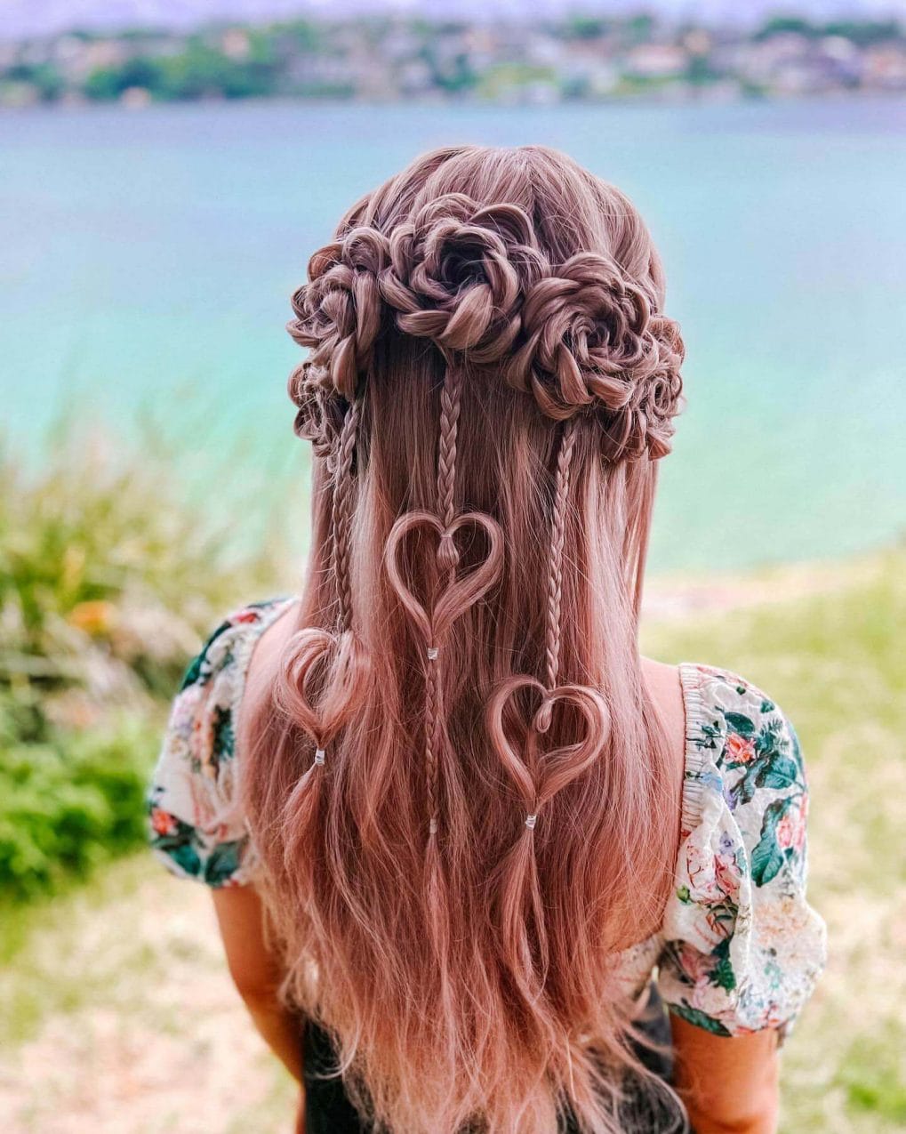 Long pink hair with intricate flower braids.