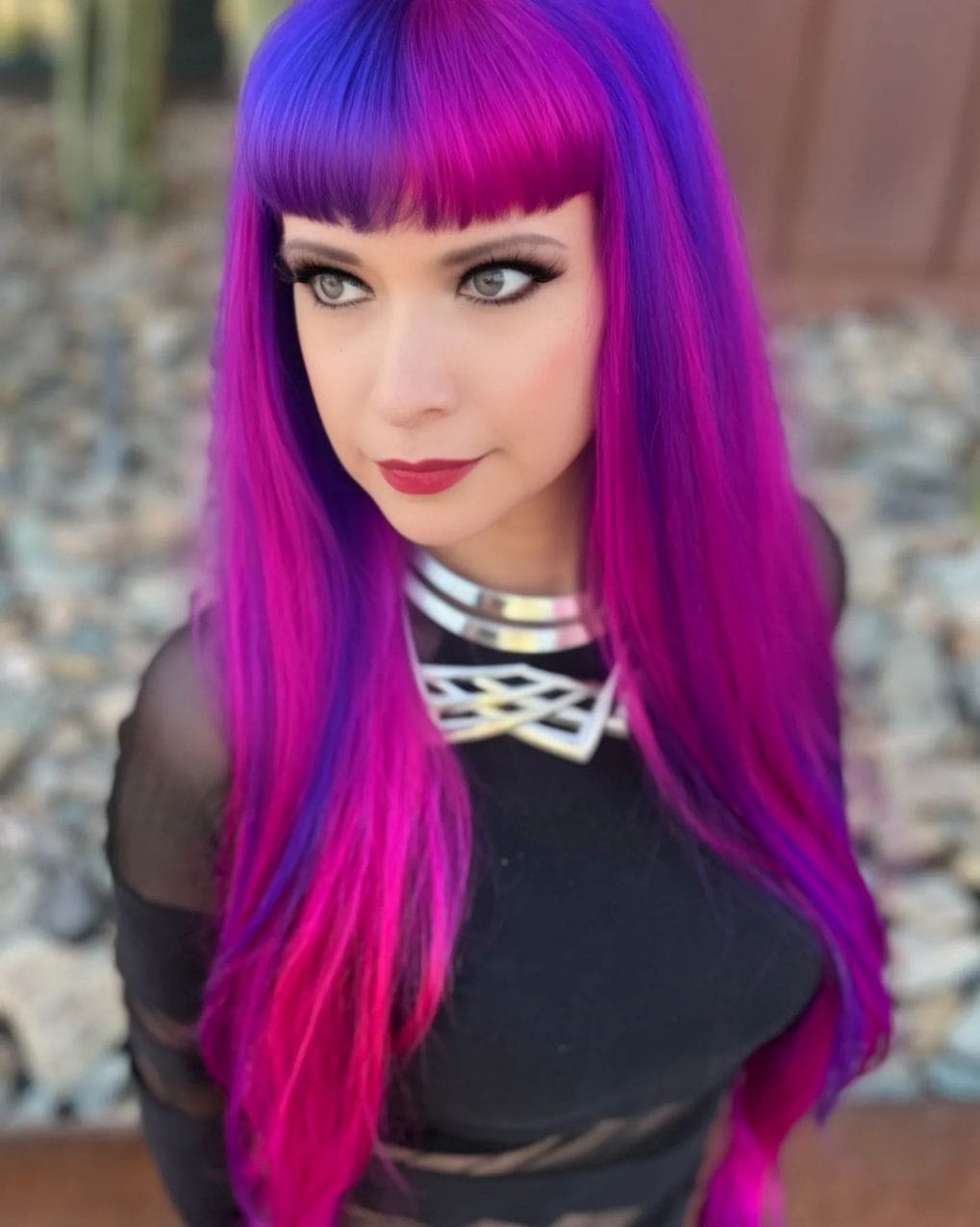 Long purple and blue hair with straight-across bangs