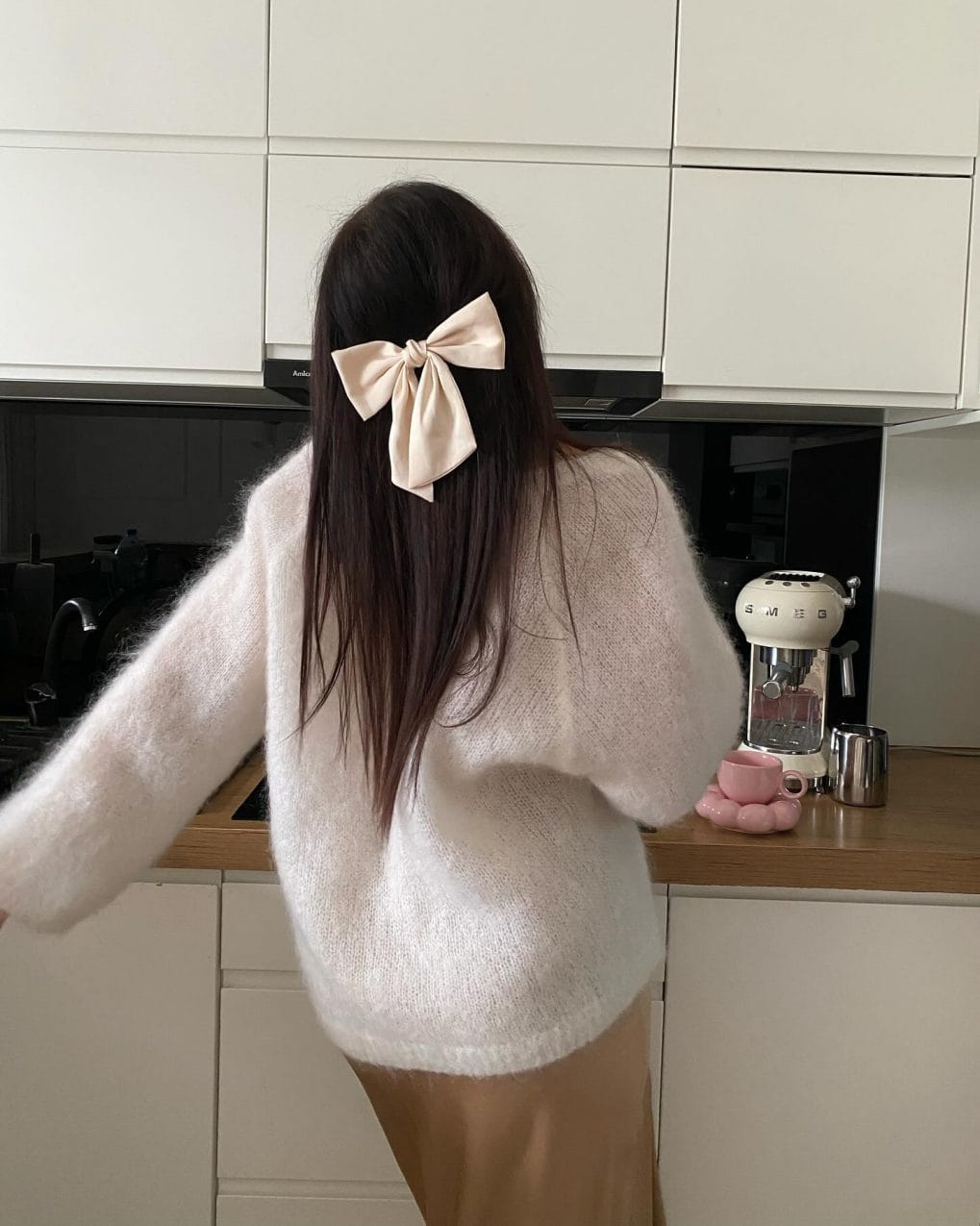 Long straight brunette tied with bow for a casual look
