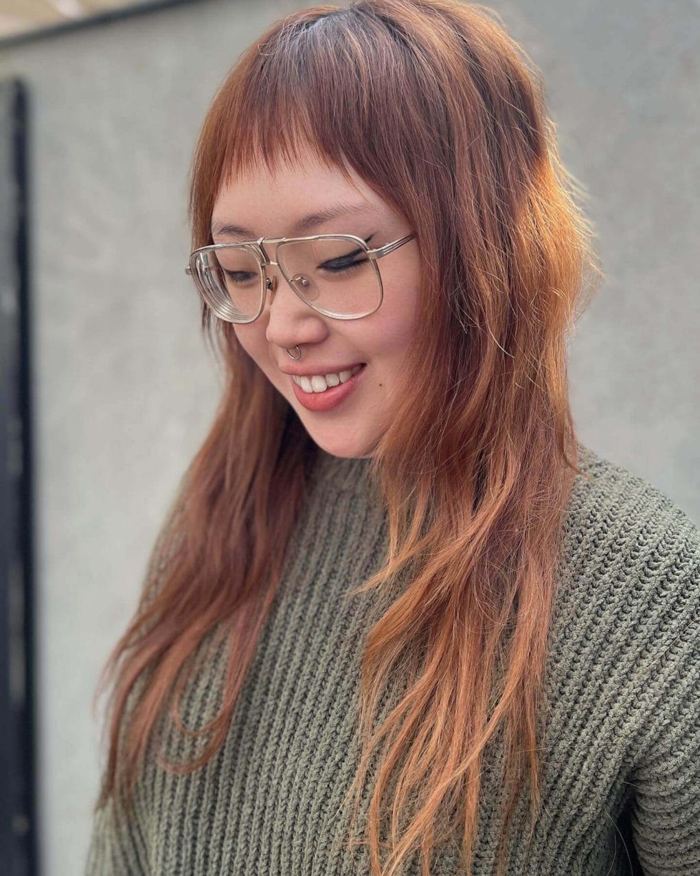 Long wavy hair with a bold micro-fringe
