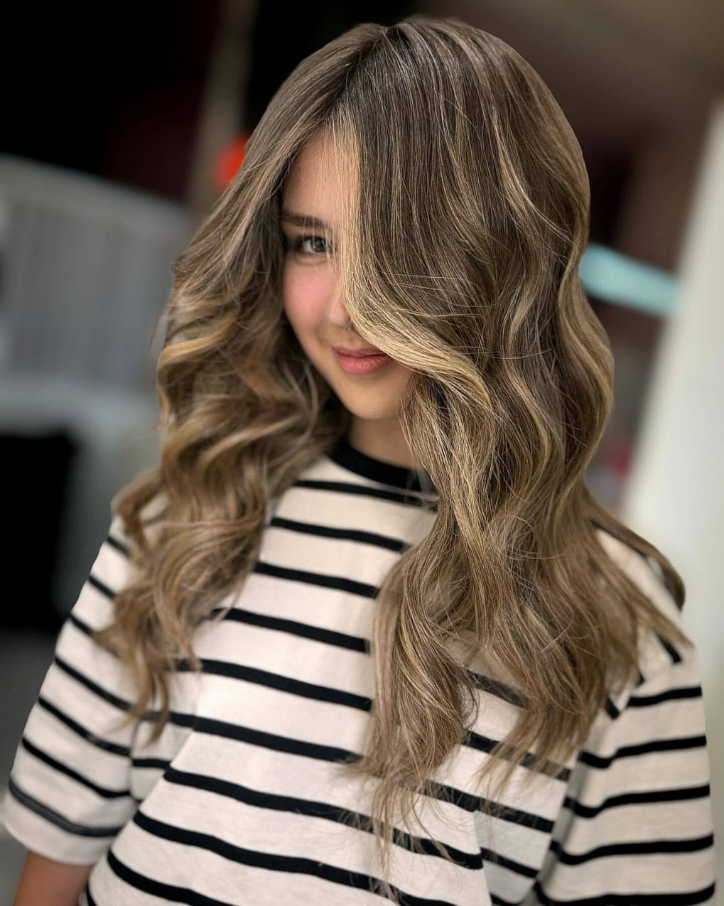 Long wavy hair with dark brown and ash blonde balayage