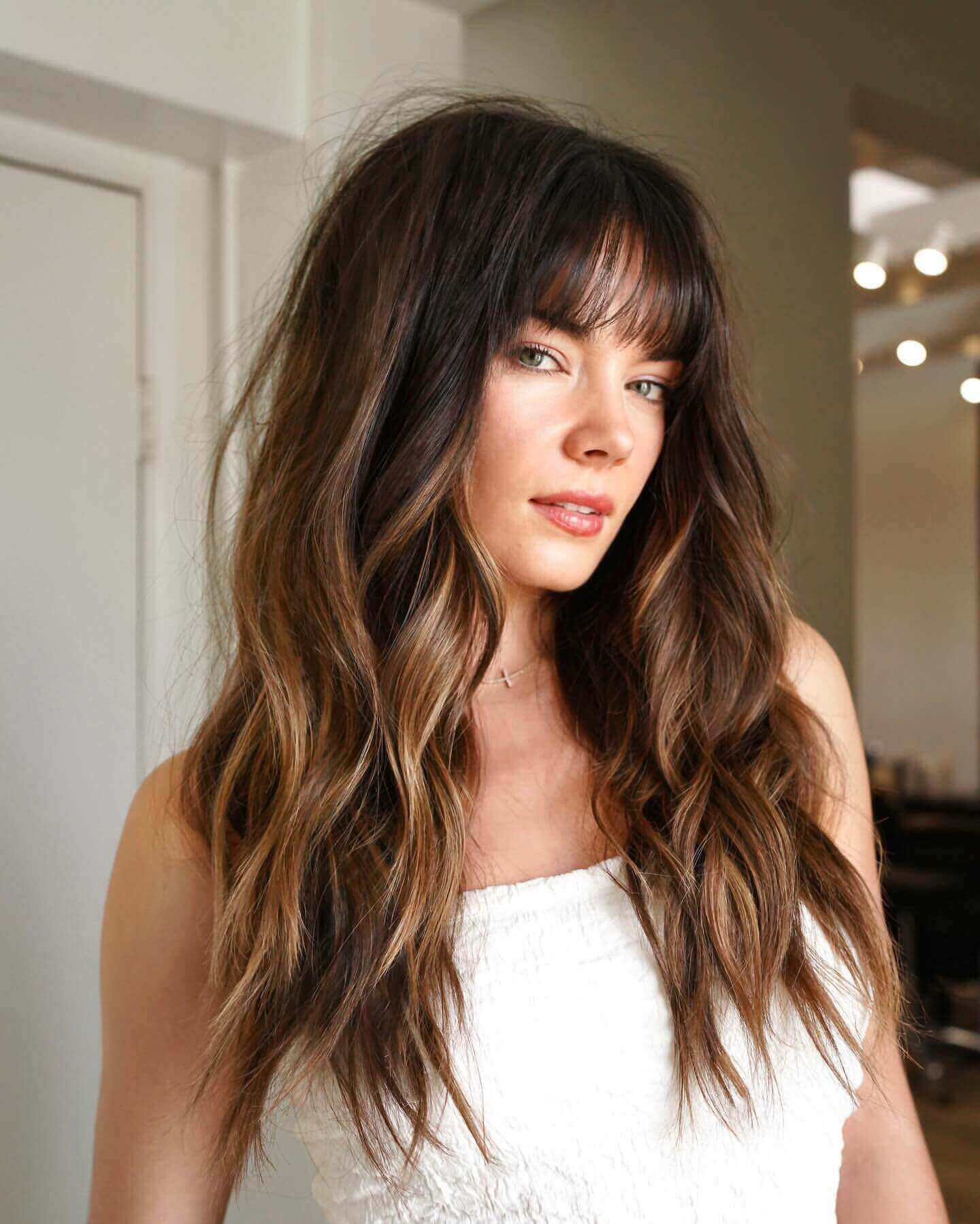 Long wavy dark brown hair with see-through bangs