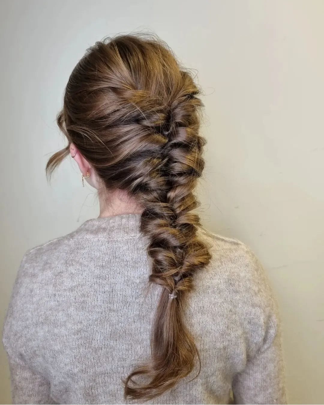 Loose French braid in dimensional brown shades for graceful volleyball action