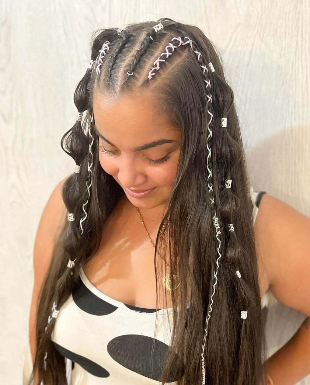 Combination of loose waves and braids with sparkling silver beads.