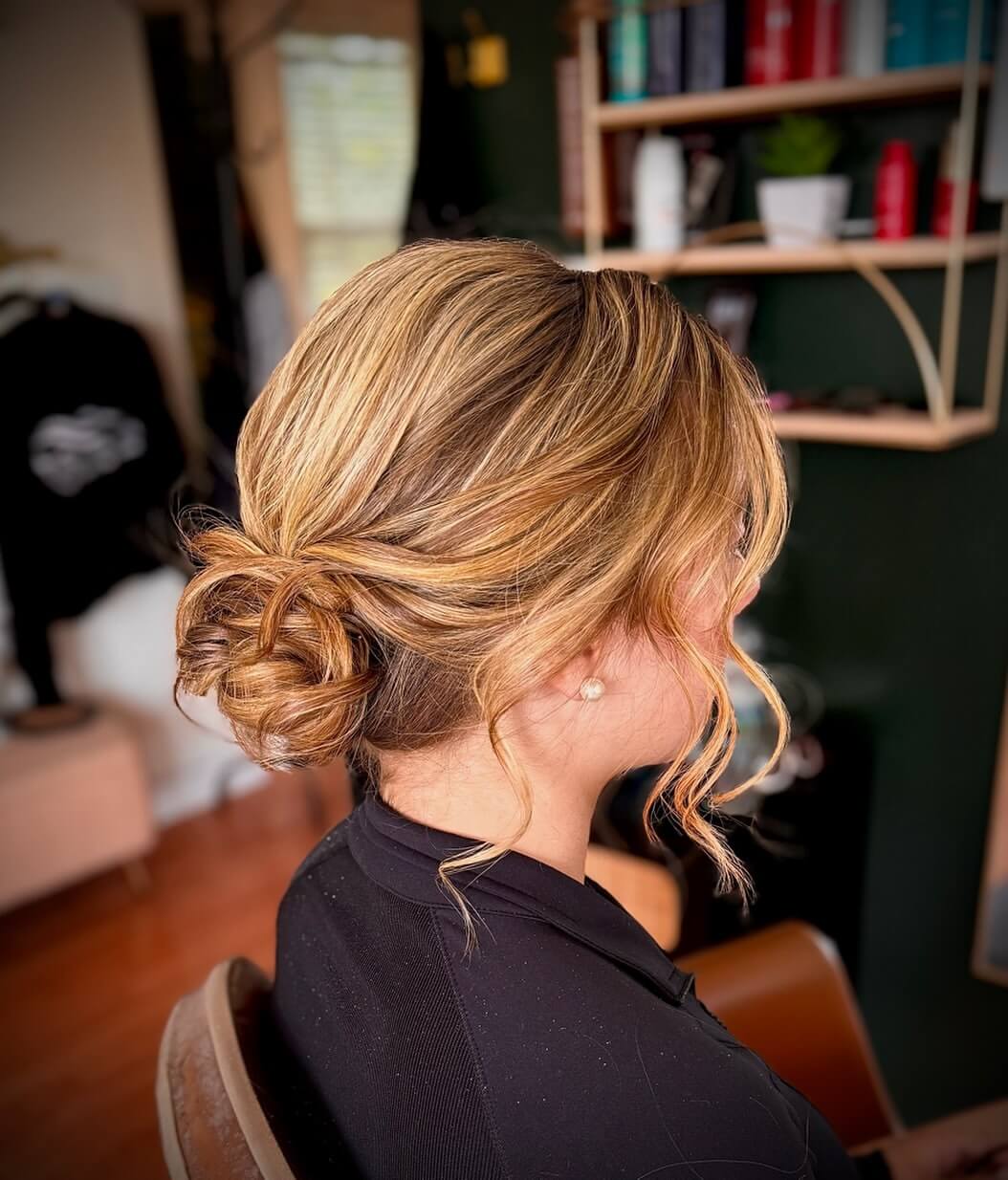 Sophisticated low bun with light brown and blonde highlights