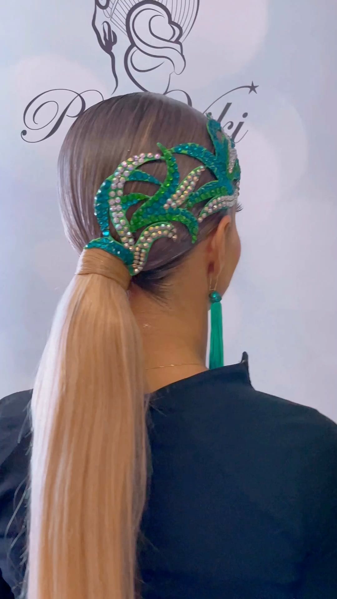 Low ponytail with creative green and blue hairpiece