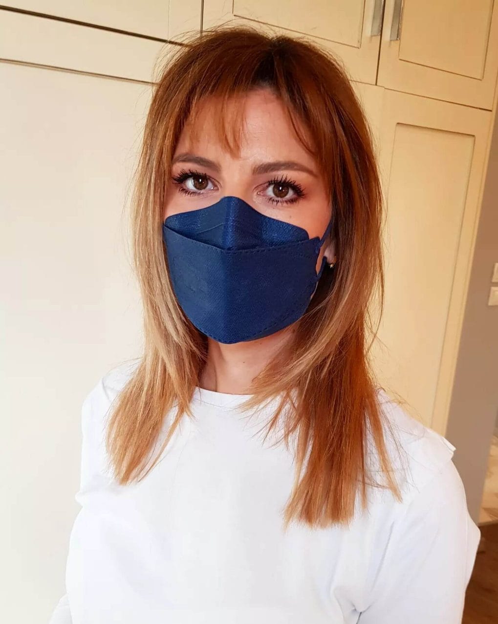 Mid-length caramel hair with breezy see-through bangs