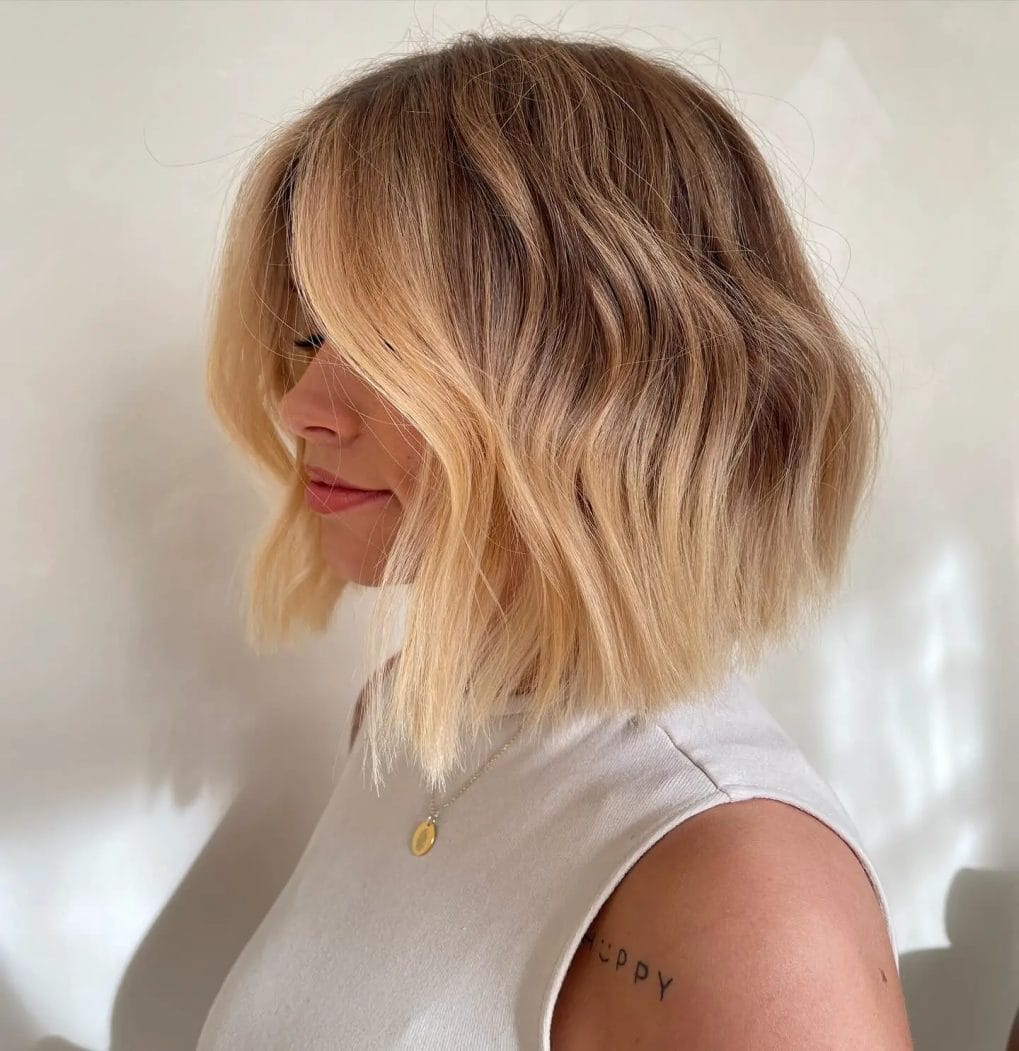 Modern classic bob with soft waves and sun-kissed balayage, cut at chin length