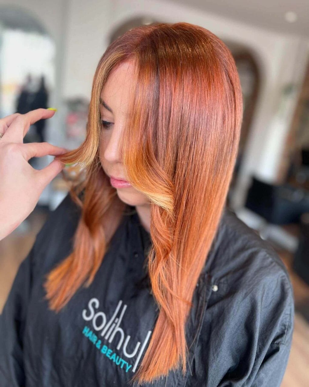 Modern copper hair with sleek side part