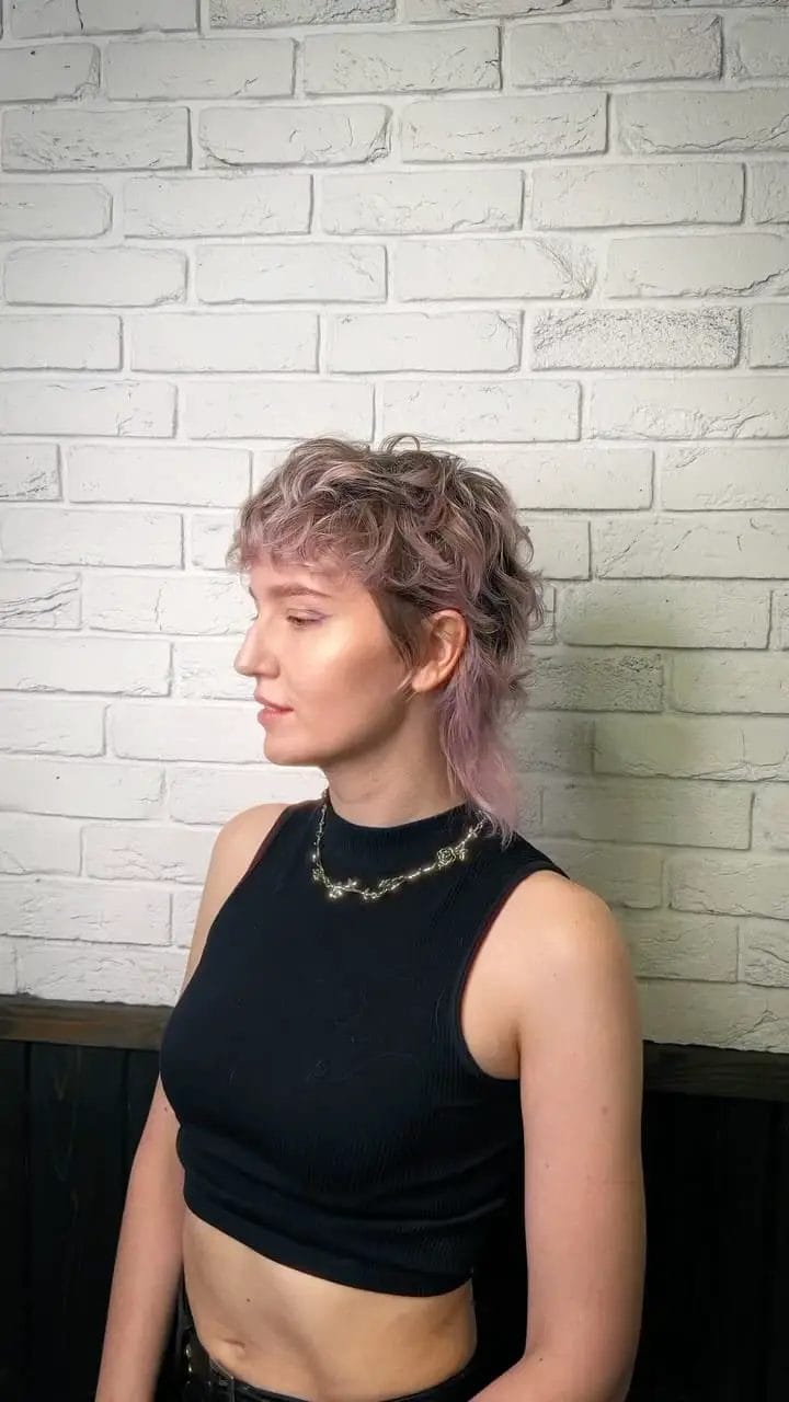 Modern twist on mullet with asymmetrical cut and lilac color