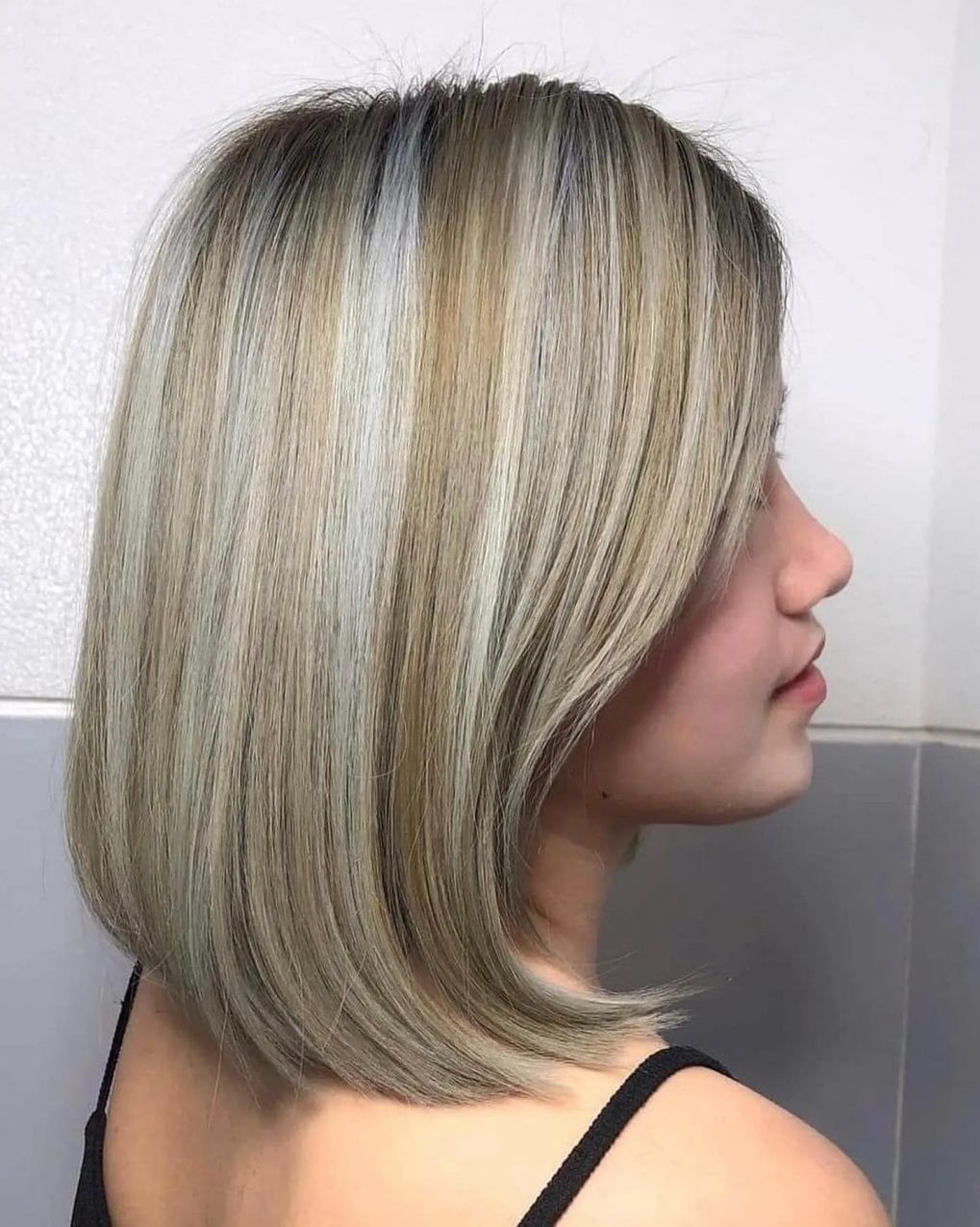 Modern bob with cool-toned highlights and smooth finish.