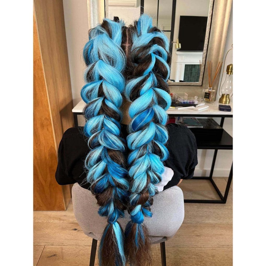 Deep and sky blue thick rope-like braids cascading downwards