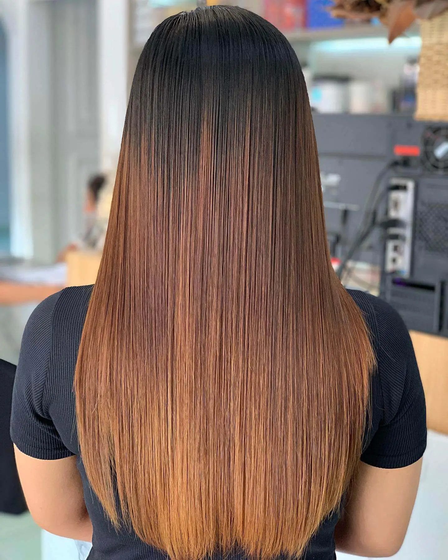 Onyx to fiery copper gradient in a sleek U-shaped haircut without layers.