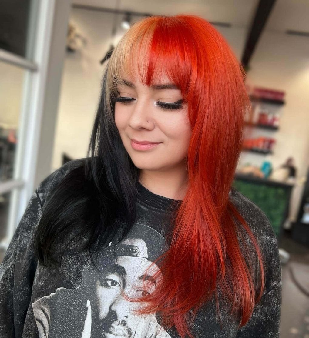 Striking orange meets midnight black with straight-across bangs