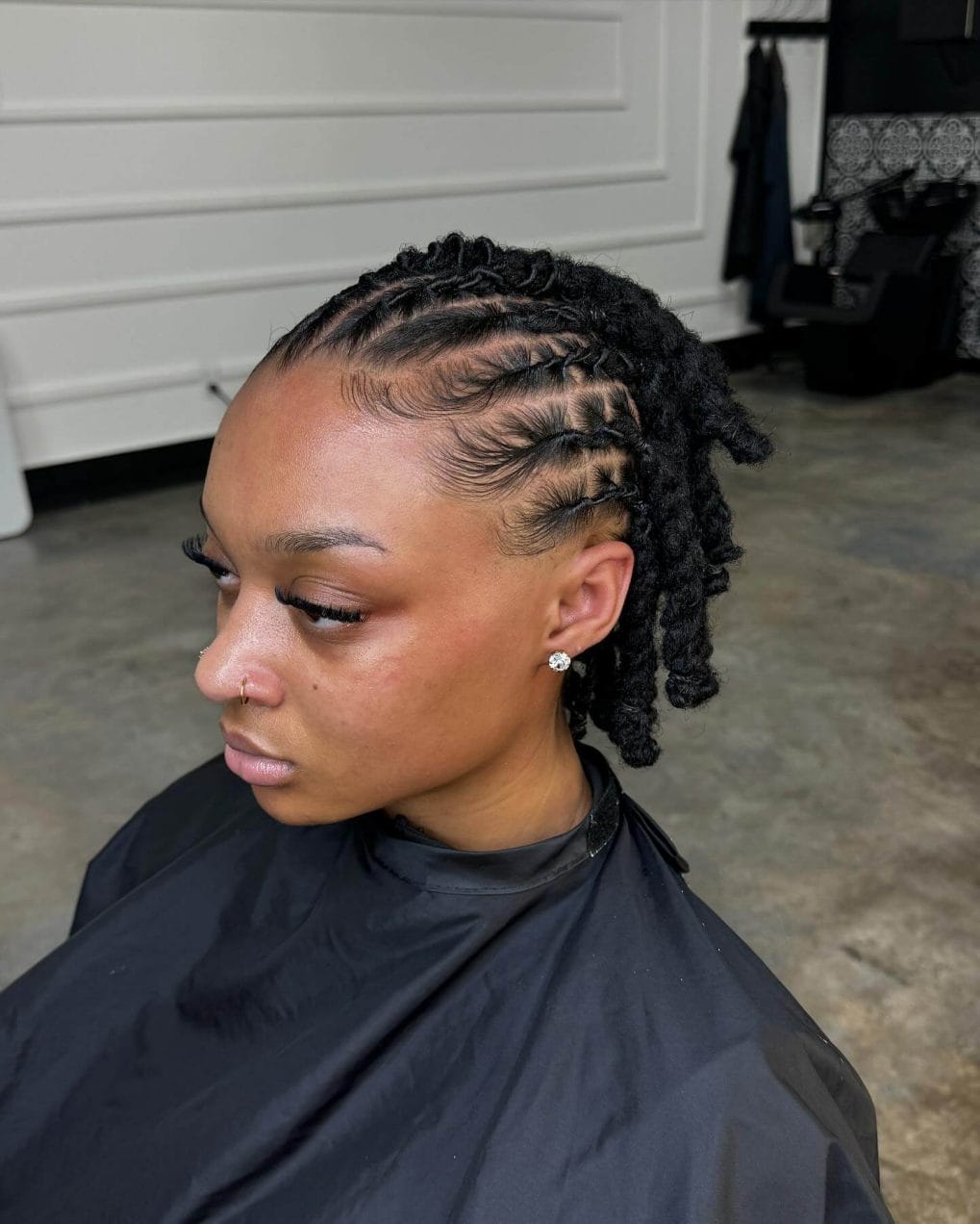 Partial updo with sleek cornrows and voluminous twisted bun