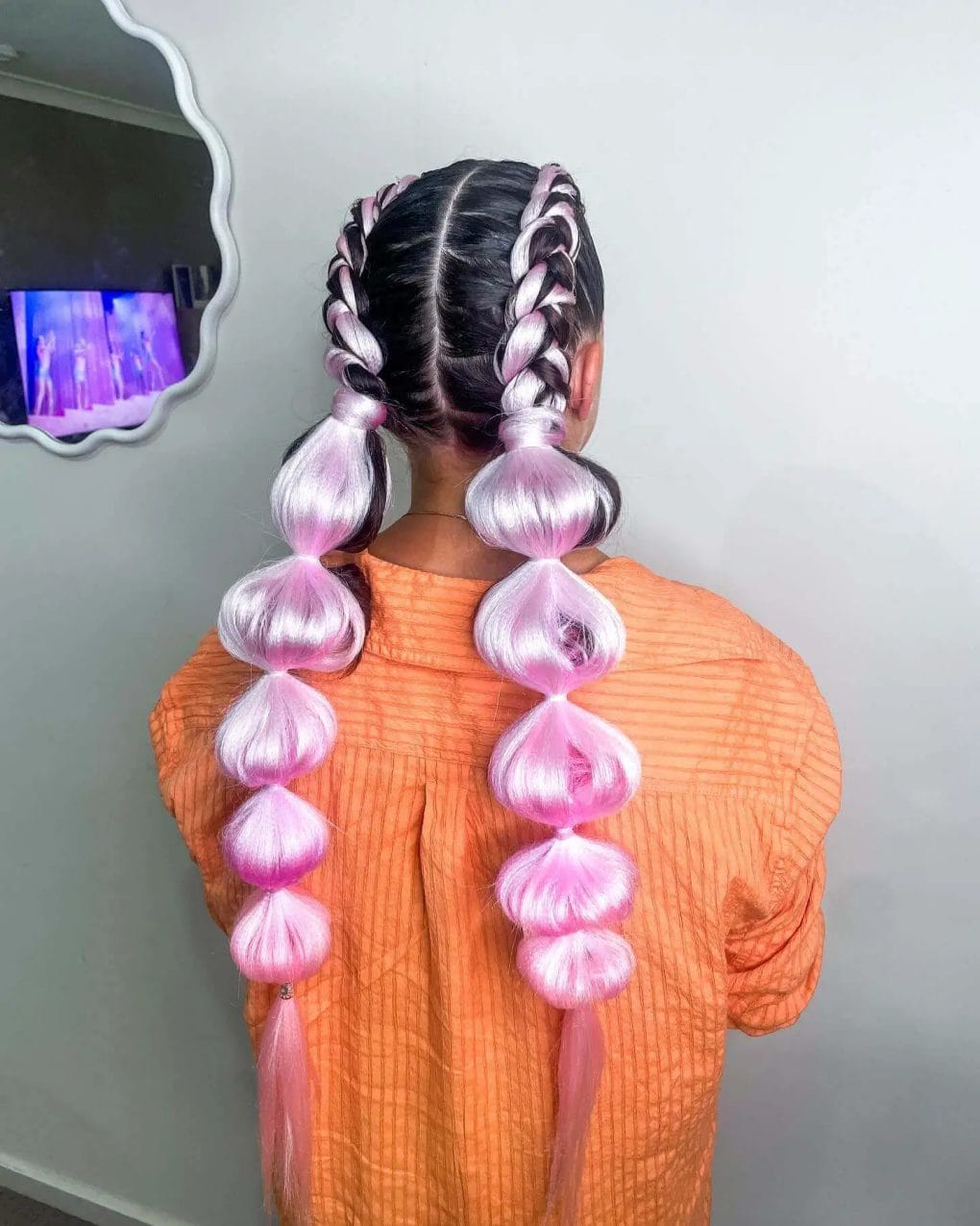 Pastel purple to pink double Dutch braids with bubble ponytails