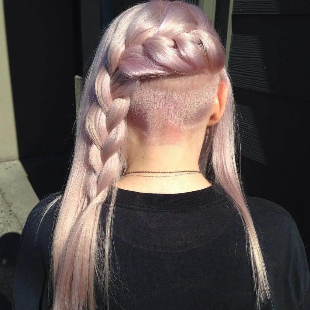 Soft pastel pink braid showcasing long, silky strands with a sharp, hidden undercut beneath.
