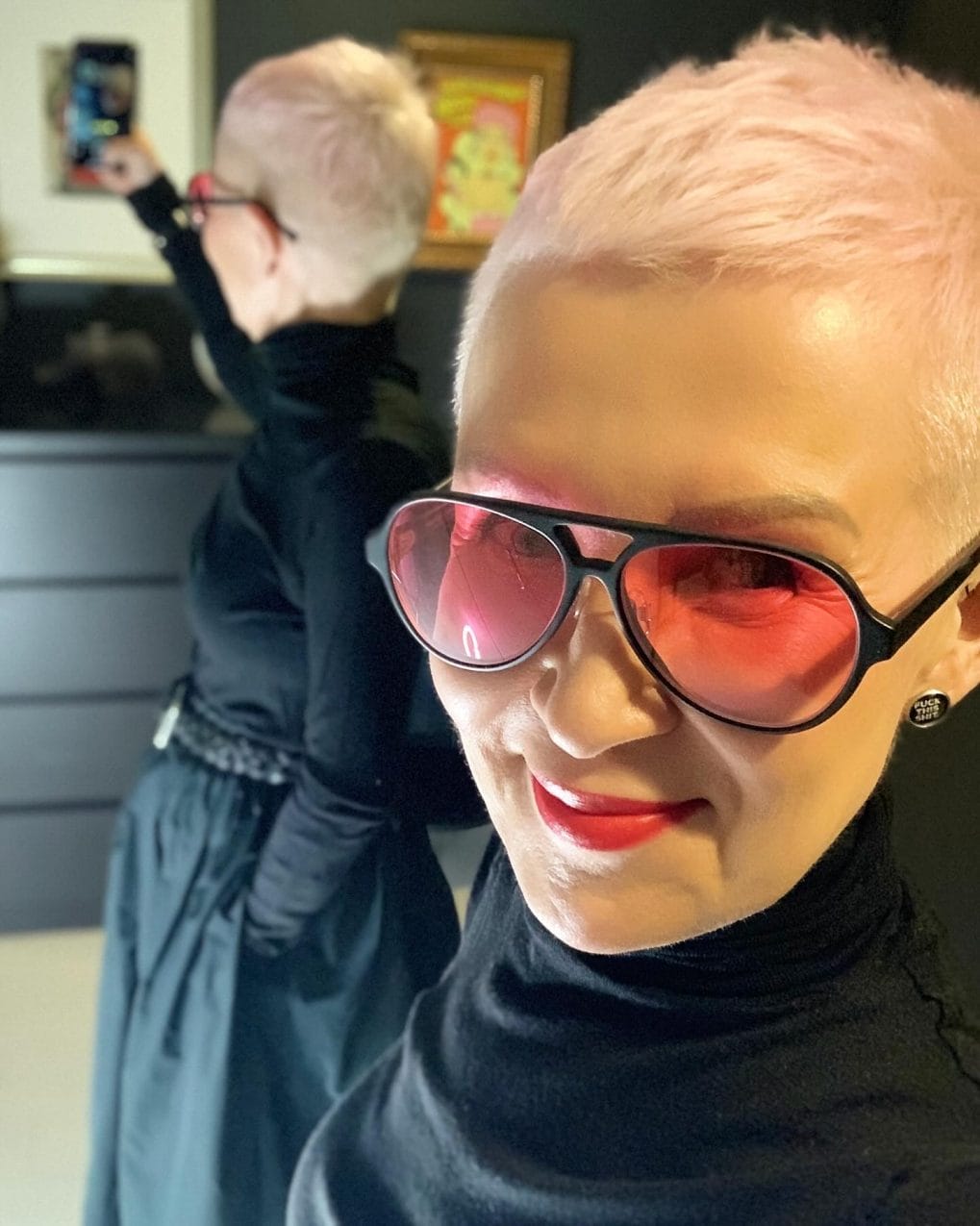 Ultra-modern pastel pink buzz cut showcasing personality