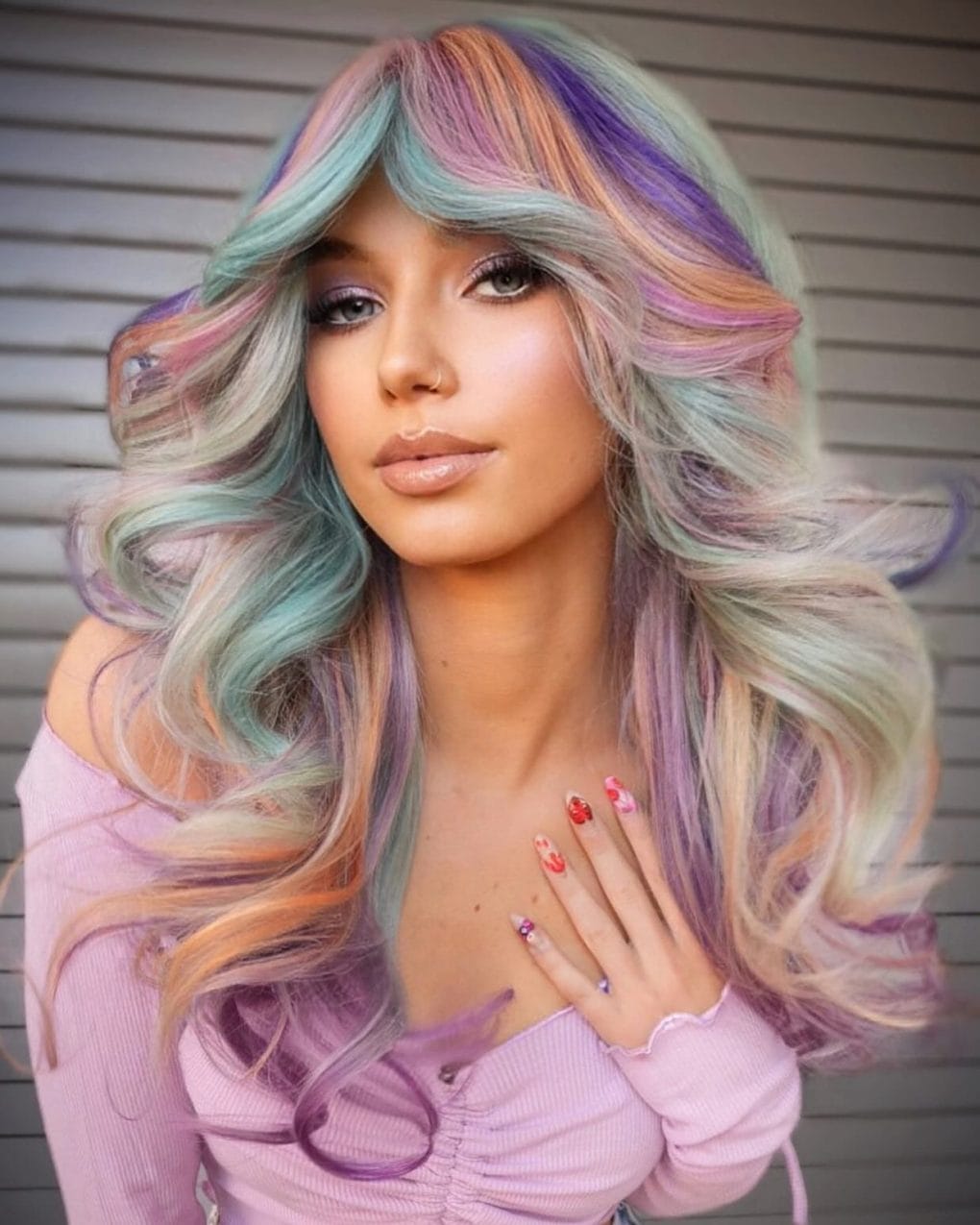 Pastel sunset-inspired waves with playful side bangs