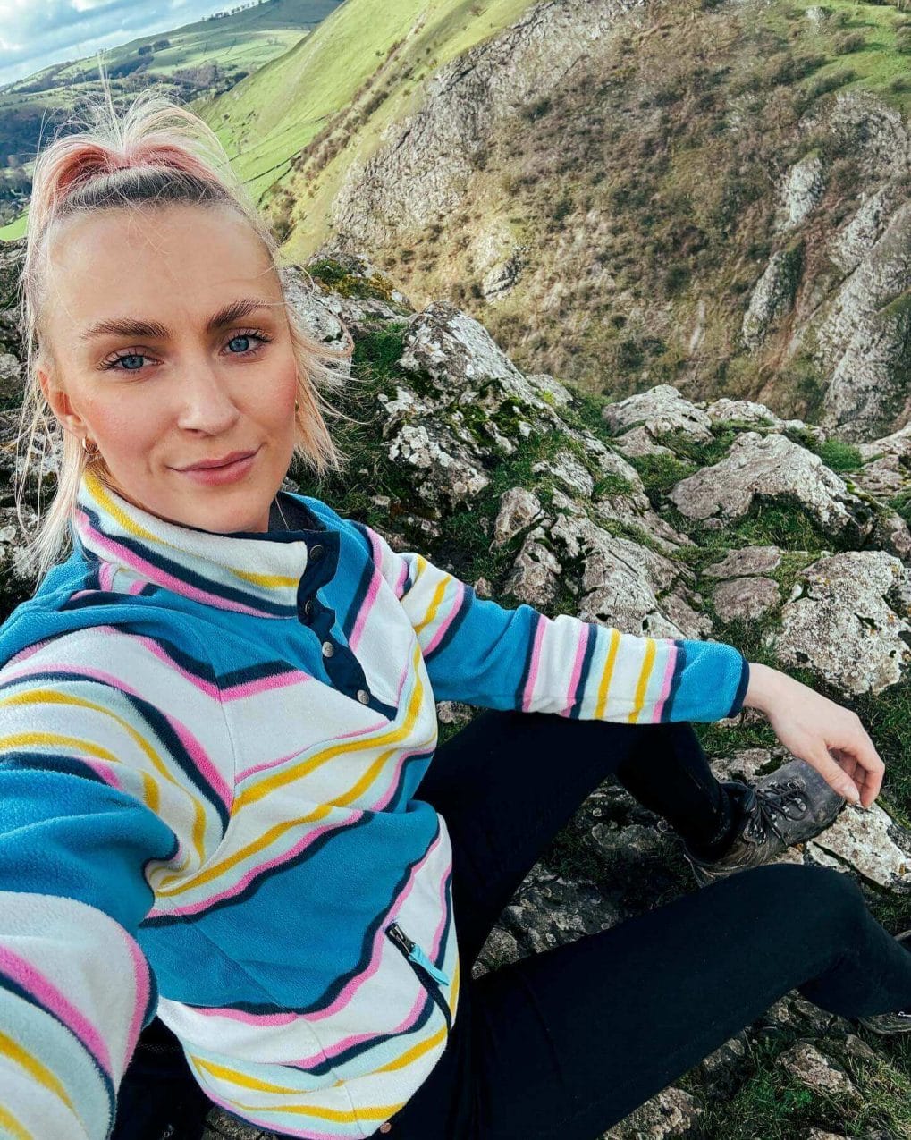 High ponytail with pink and blonde strands on nature trail