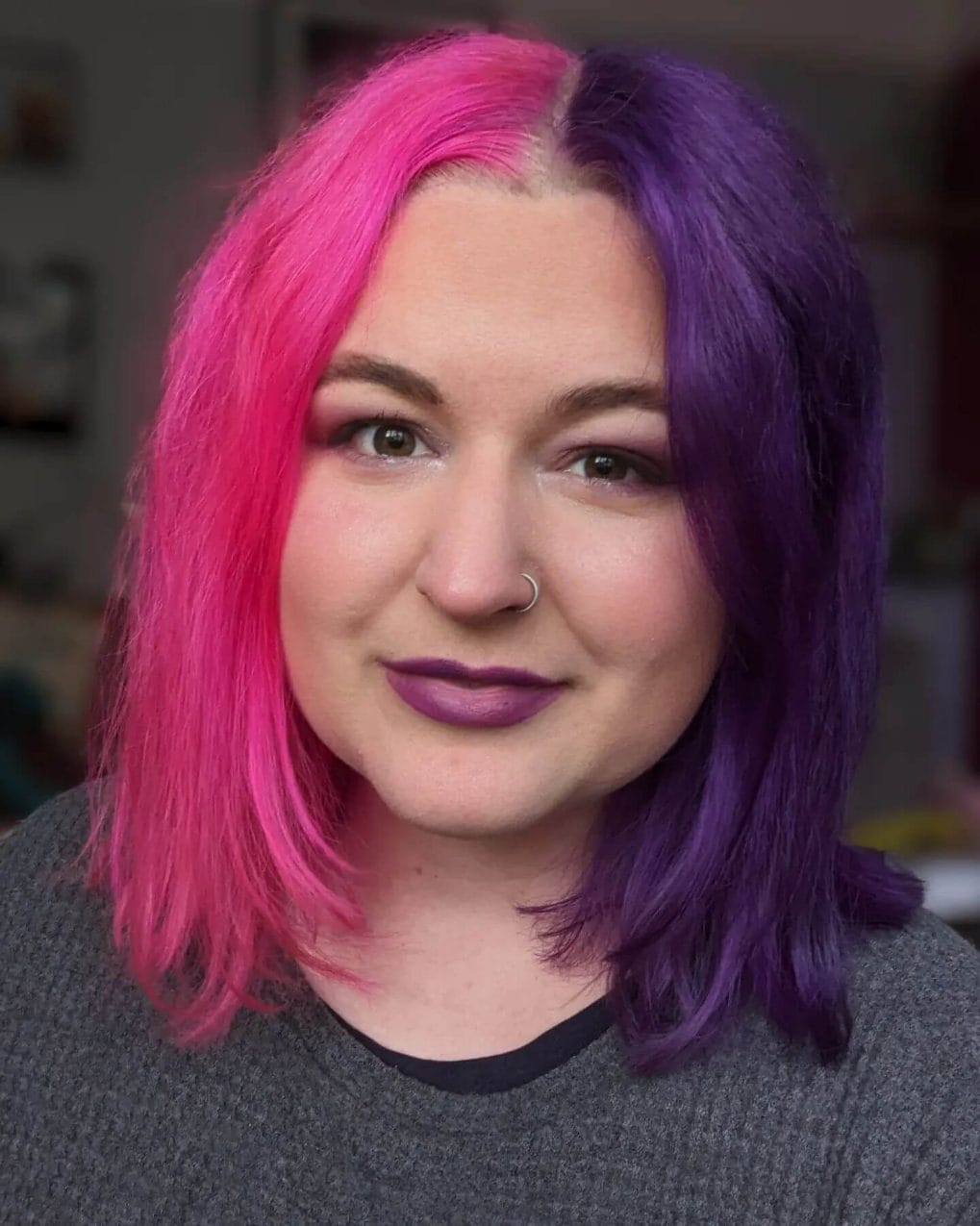 Shoulder-length cut with pink and purple split and side-swept bangs