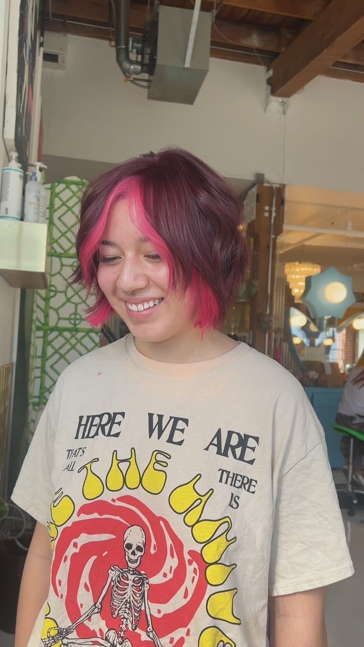 Textured pink bob with deeper magenta face highlights
