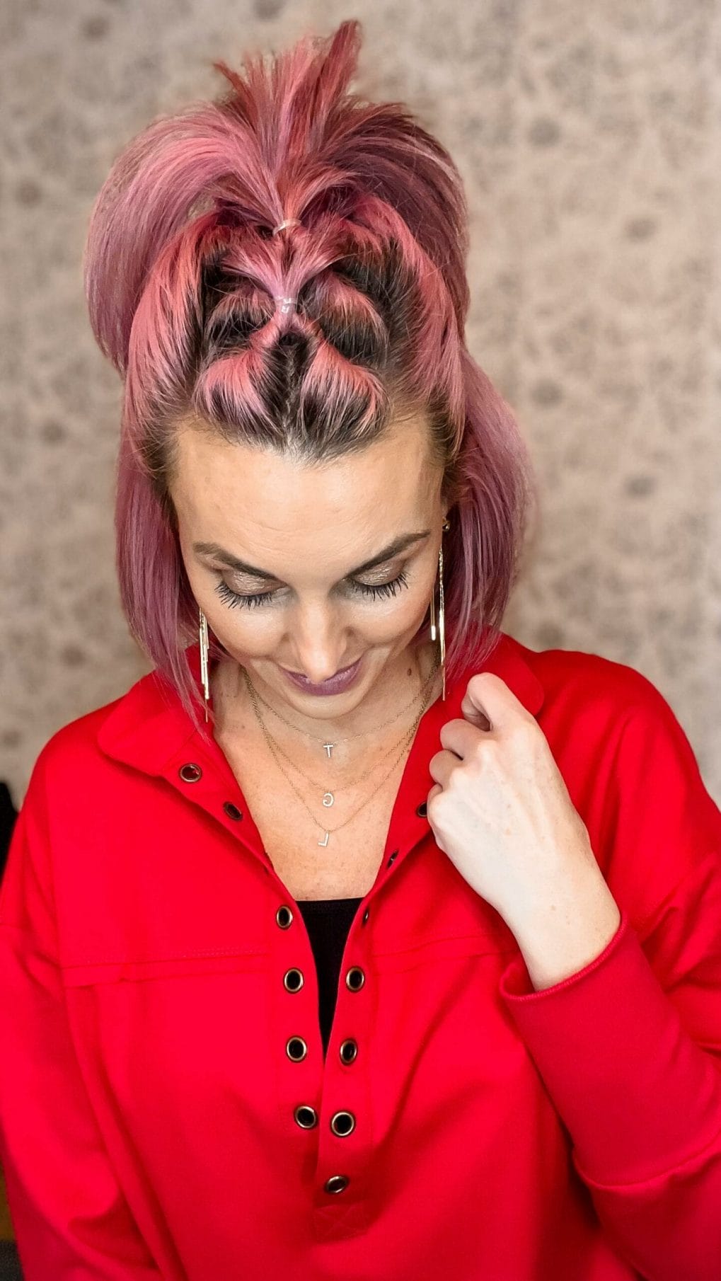 Bold pink topknot with heart design on the back, showing off personality at the gym