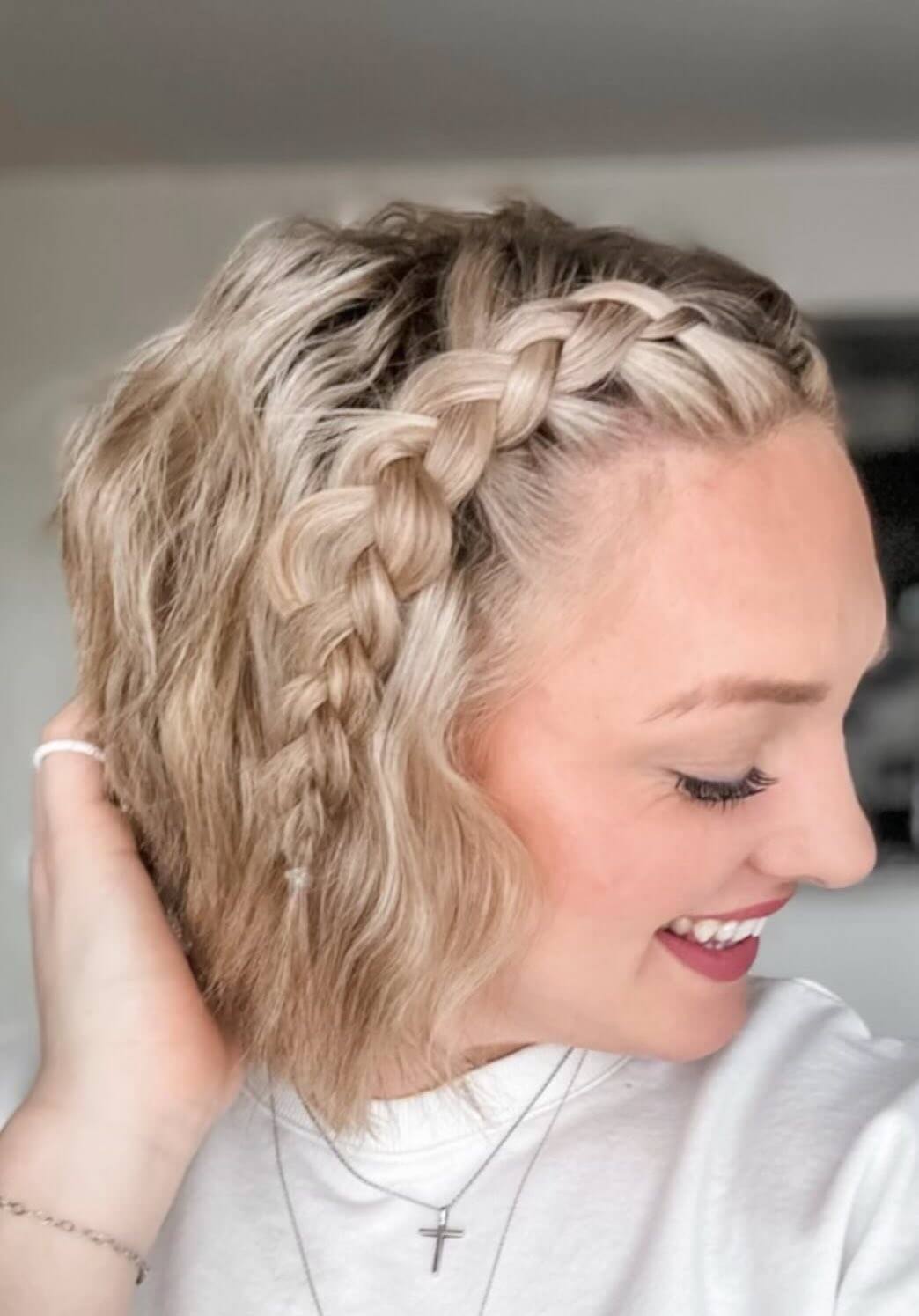 Modern platinum blonde bob with a side braid for a playful birthday twist.