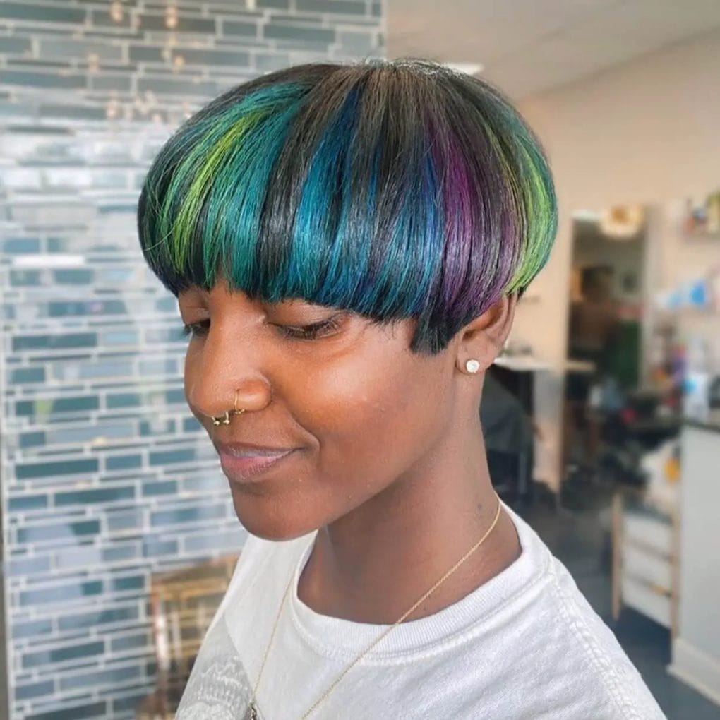 Playful mushroom cut with gradient from deep blue to electric greens and purples.