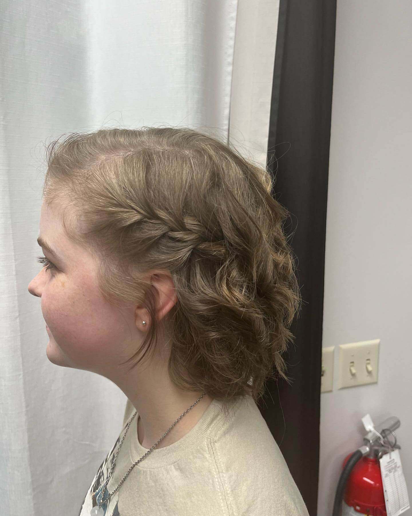 Playful wavy bob with a cute side braid